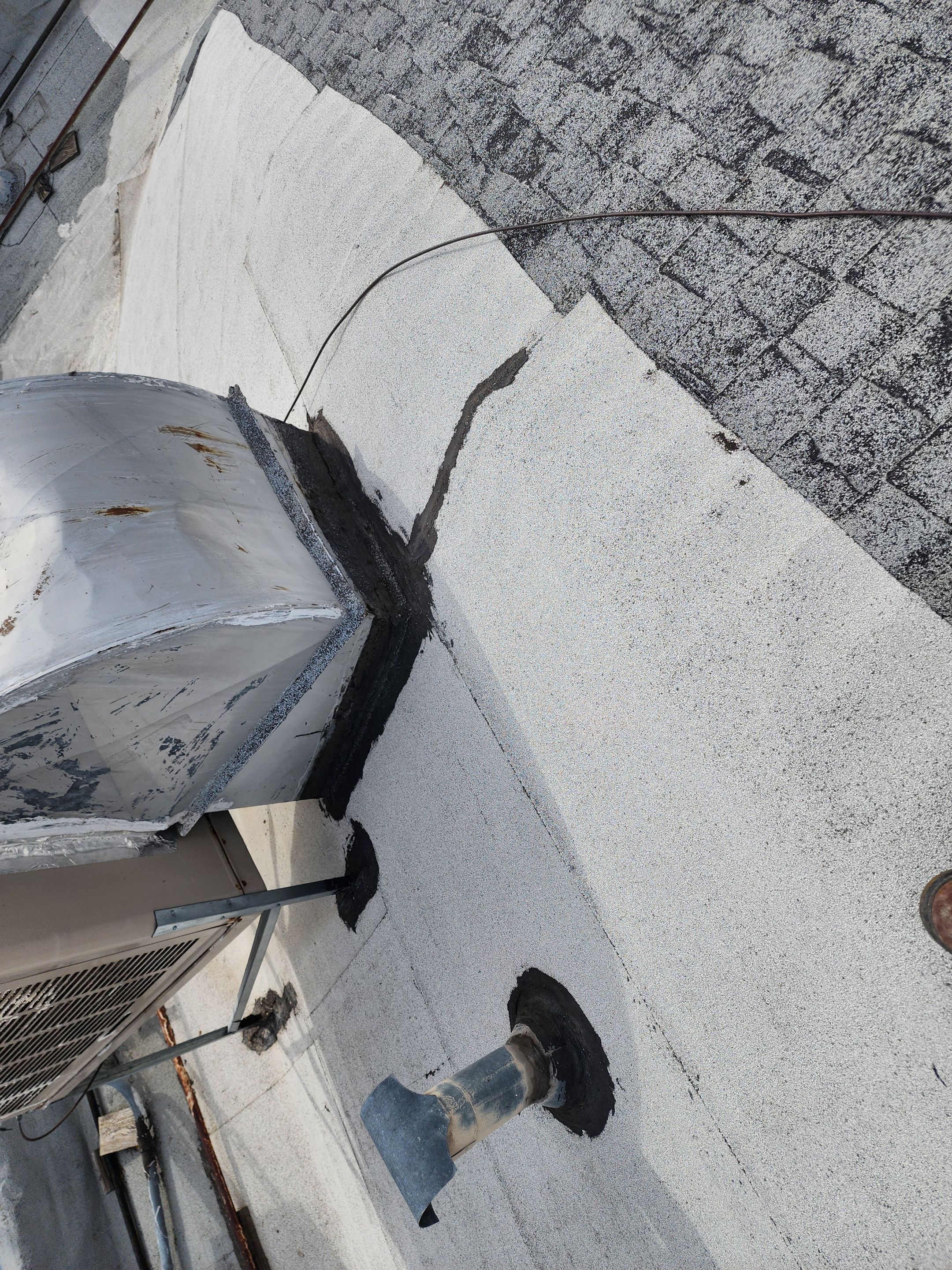 Foam and coatings on commercial roof by Straight Edge Roofing Inc