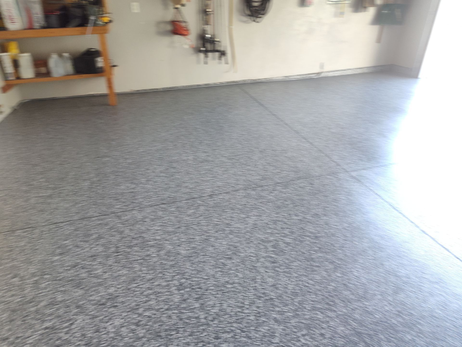 Close Up View of This Customer's New Flake Coating by Revival Concrete Coatings