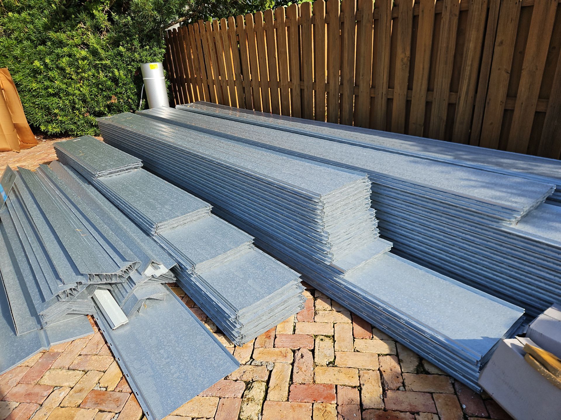 Residential Roofing Installation using 1" Nail strip metal roof by BLUES BROTHERS CONSTRUCTION CORP