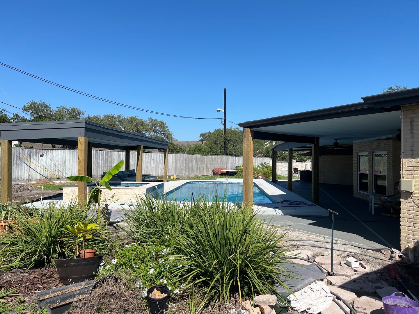Beautiful pool side build by Bayfront Roofing and Construction