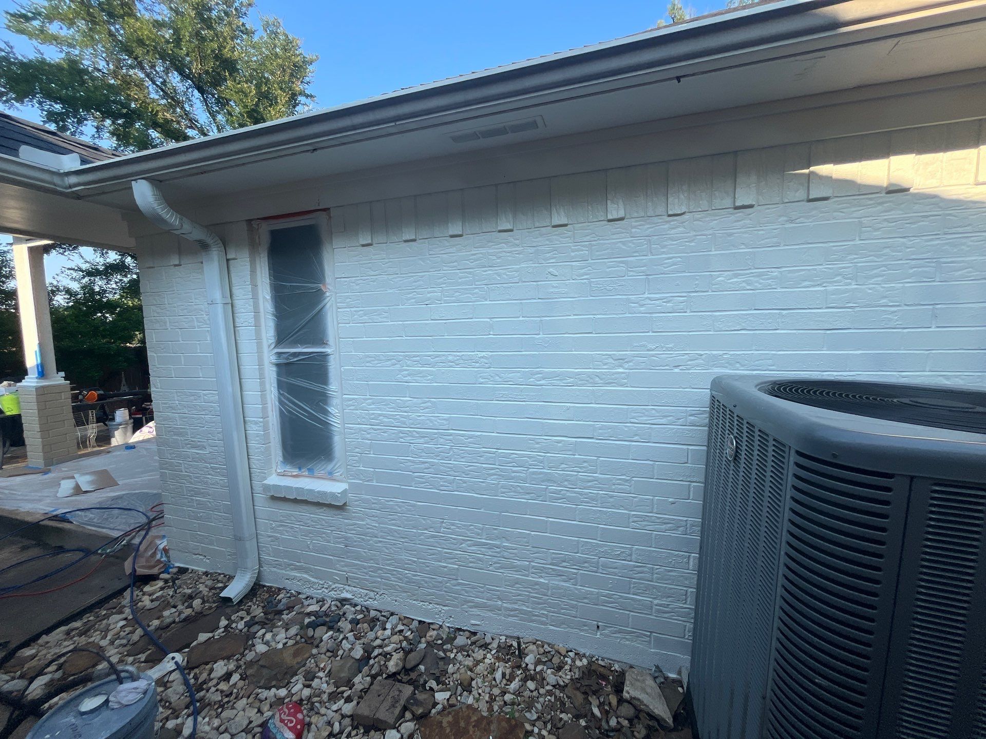 Exterior Painting in Tyler, TX | Brick House with White & Blue Finish by Quality Coats Painting