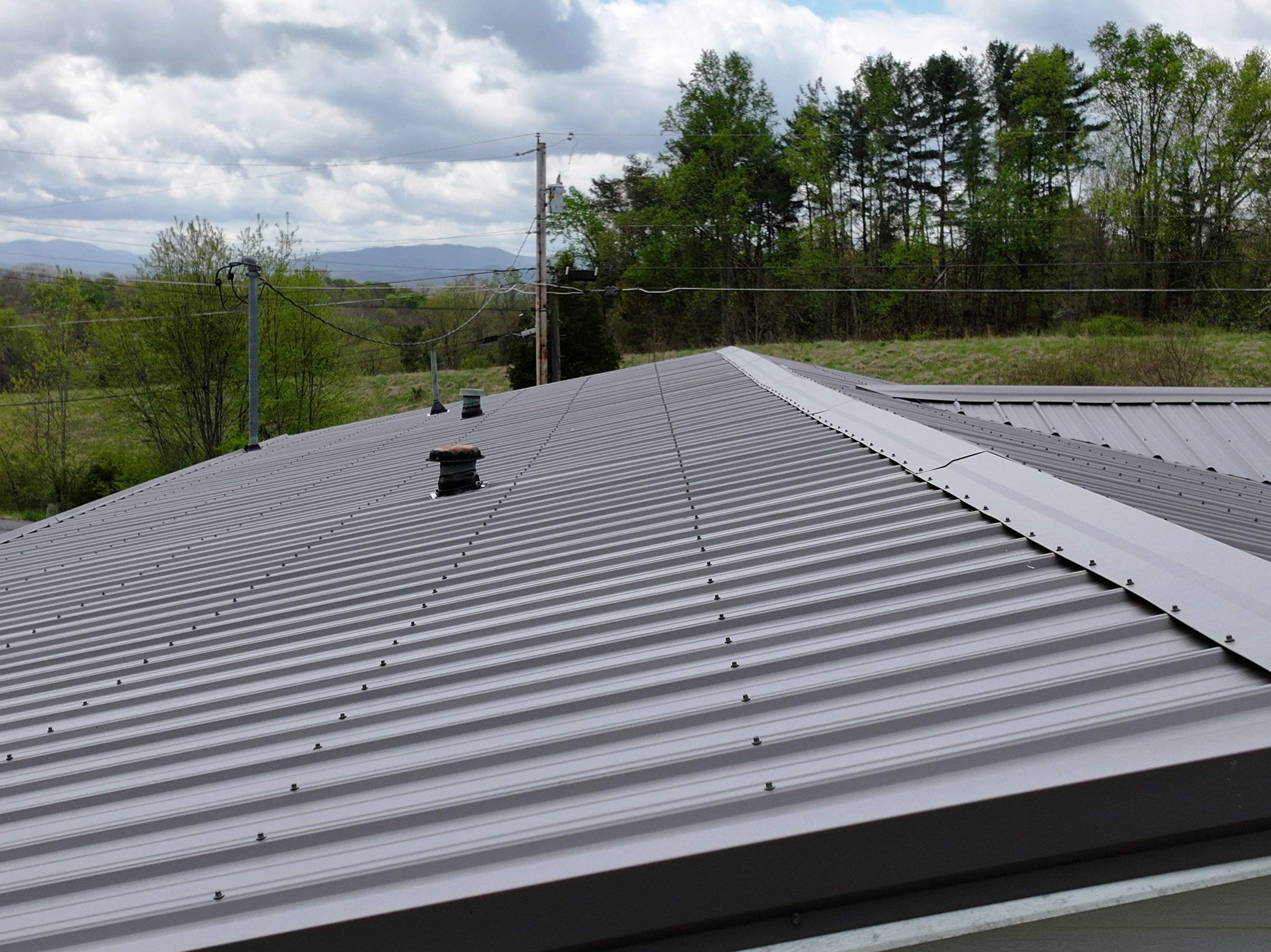 Charcoal Gray Textured Metal Roof by Omnia Roofing