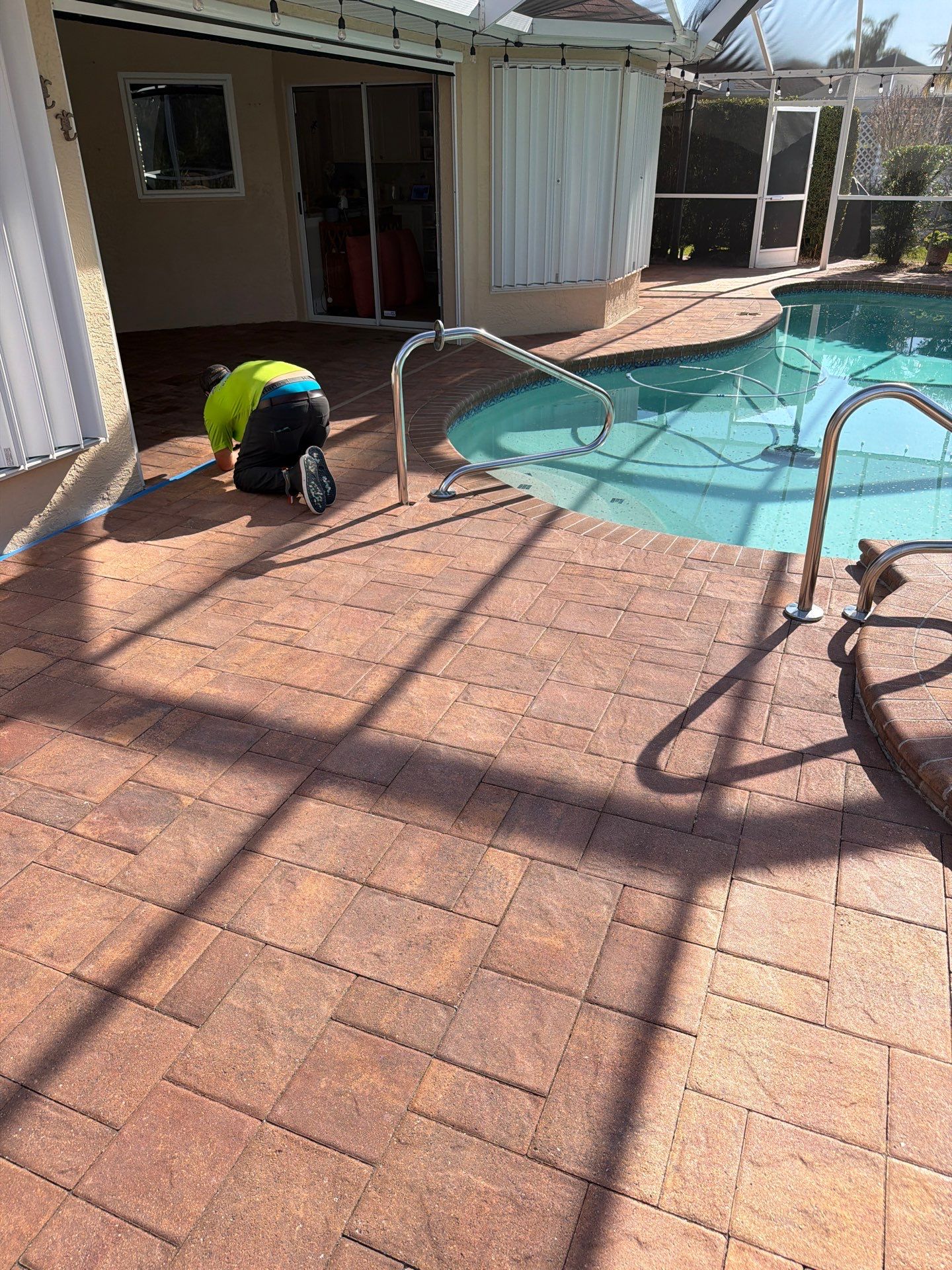 Paver Sealing and Striping for Sun City Center Pool Deck by Supreme Paver Experts