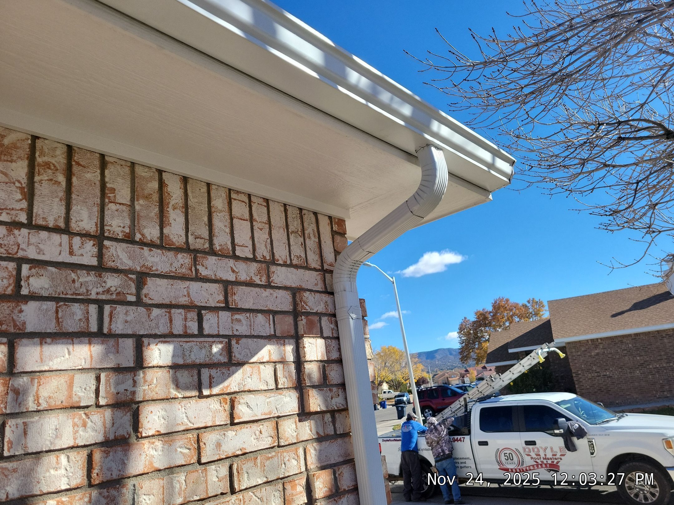 Seamless White Gutter and Downspout Installation in Albuquerque by Doyle Roof Masters Inc