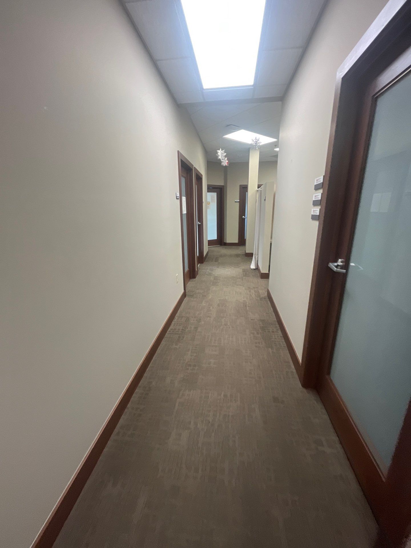 Commercial Office Interior Remodel and Modern Suite Refresh in Sioux Falls by Select Painting, Coatings & Garage Cabinets