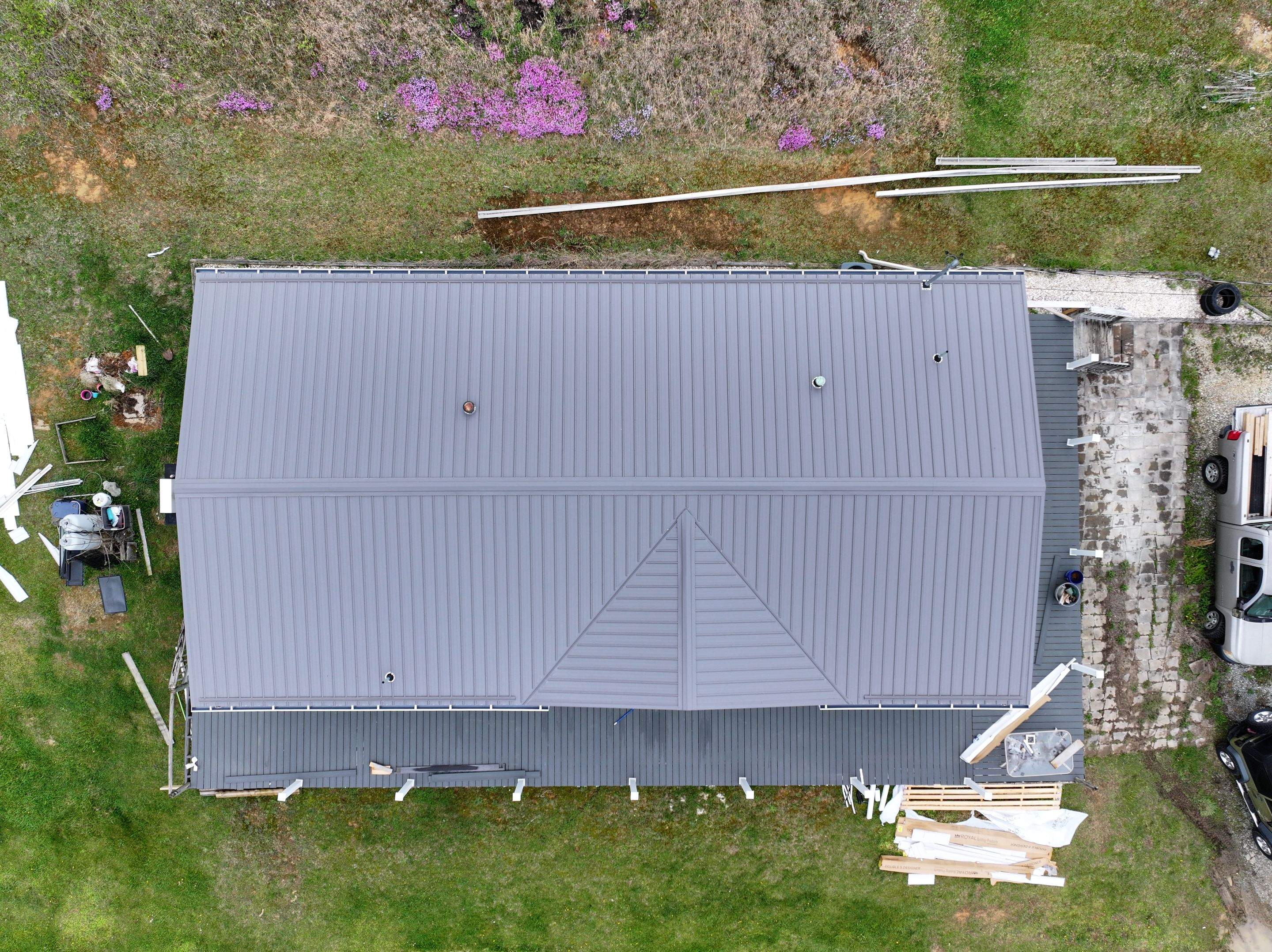 Charcoal Gray Textured Metal Roof by Omnia Roofing