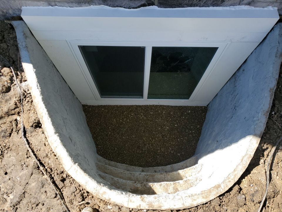 Egress Window Installation using Rockwell Egress Fiberglass Egress Window Well by Toledo Basement Repair 