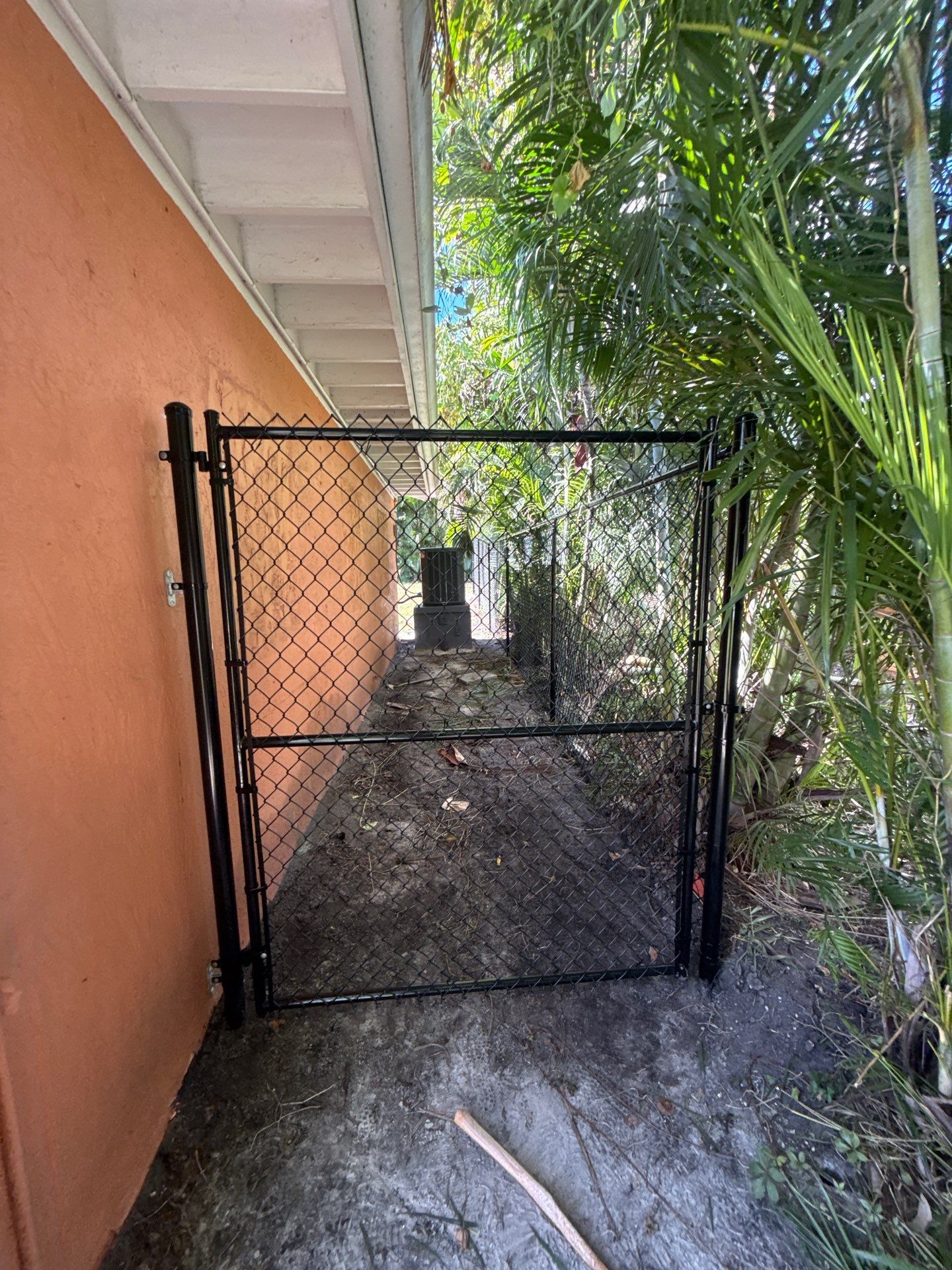 Black Chain Link Fence Installation and Site Clearing in Nokomis by True Fence LLC