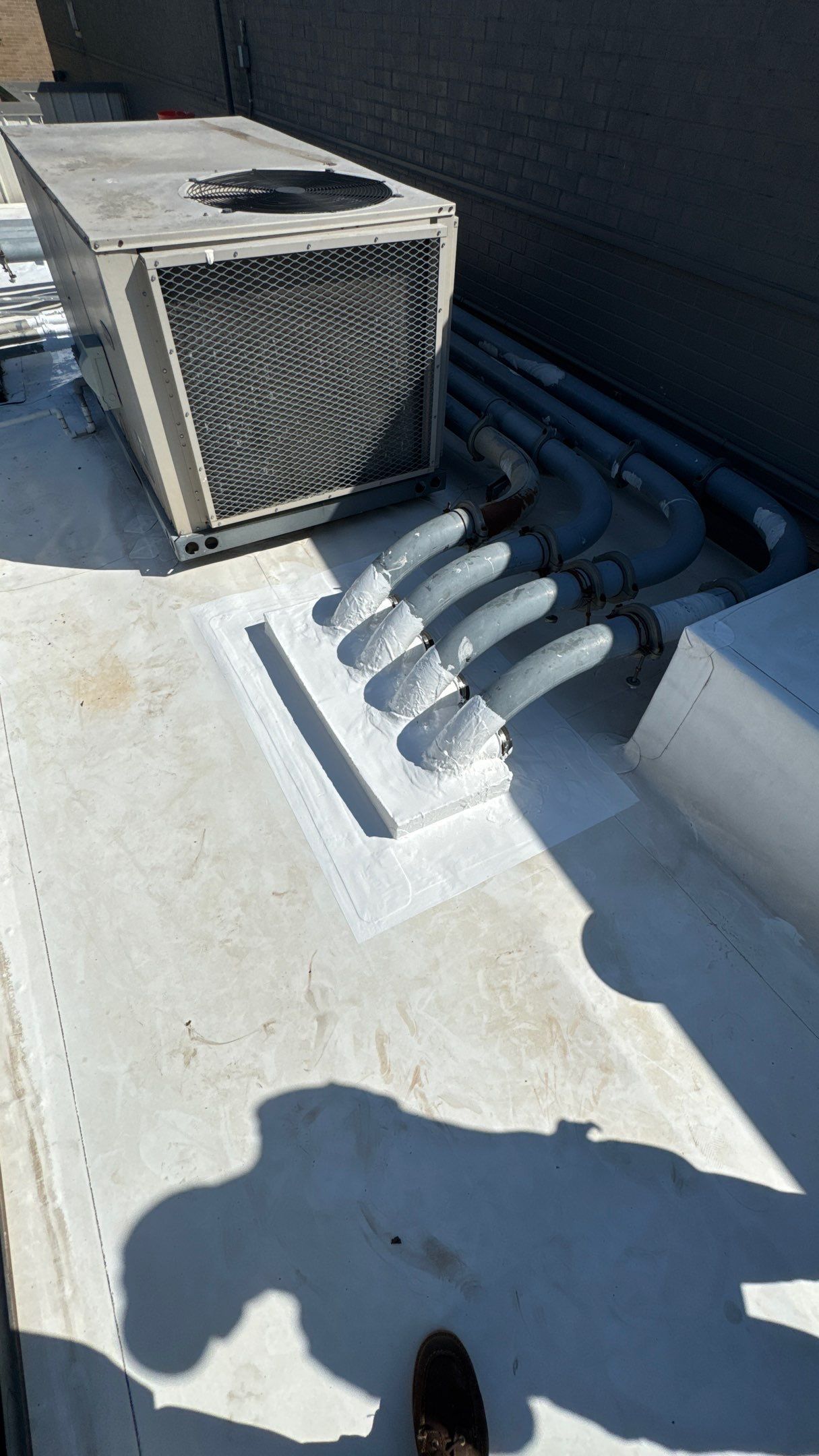 Commercial Roofing Repair using TRP #924 Eterna-Sil Premium Silicone Roof Coating by Harvey Roofing & Construction