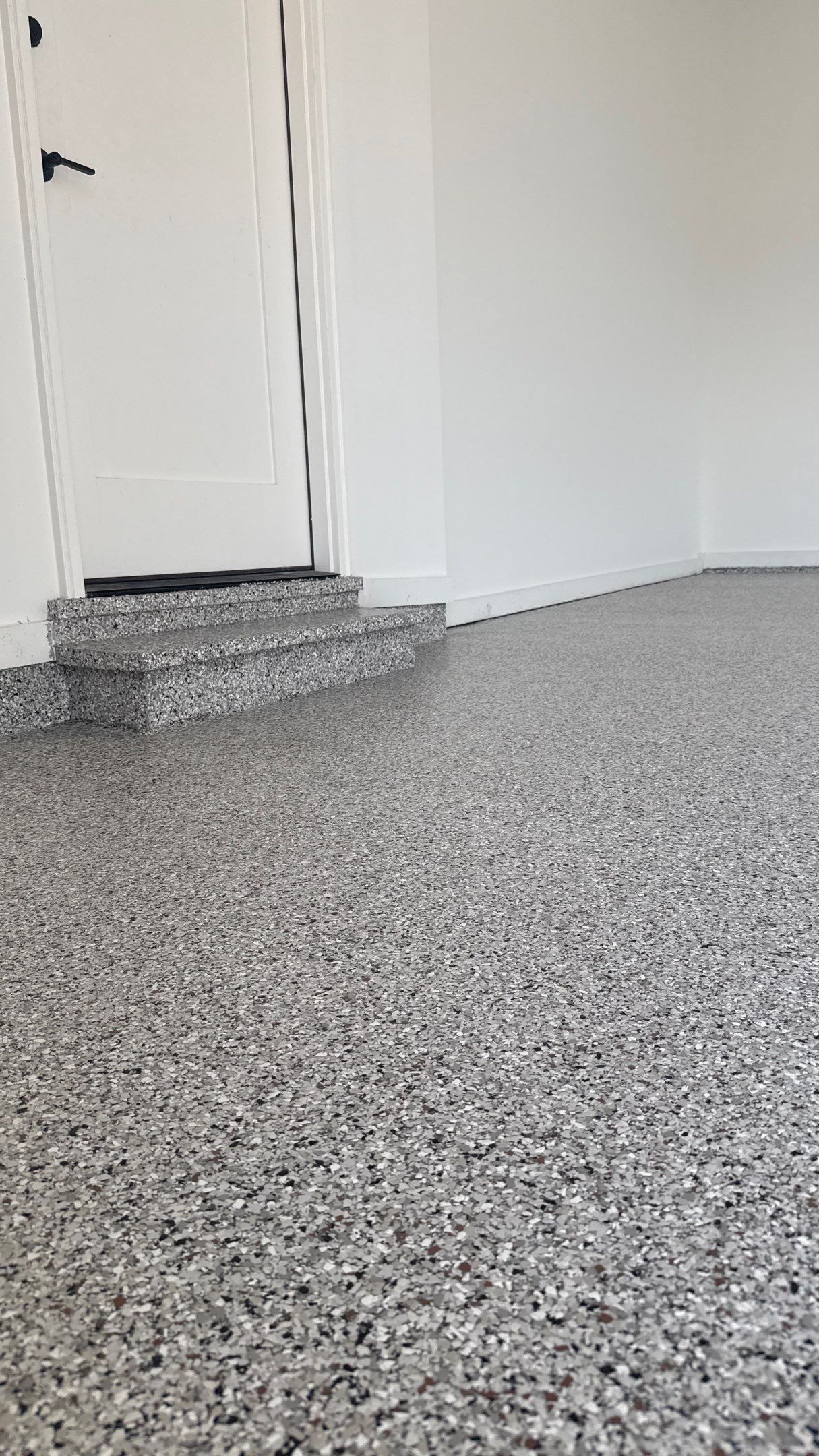 Custom Garage Epoxy Flake Floor Coating in Leawood by Banner Garage