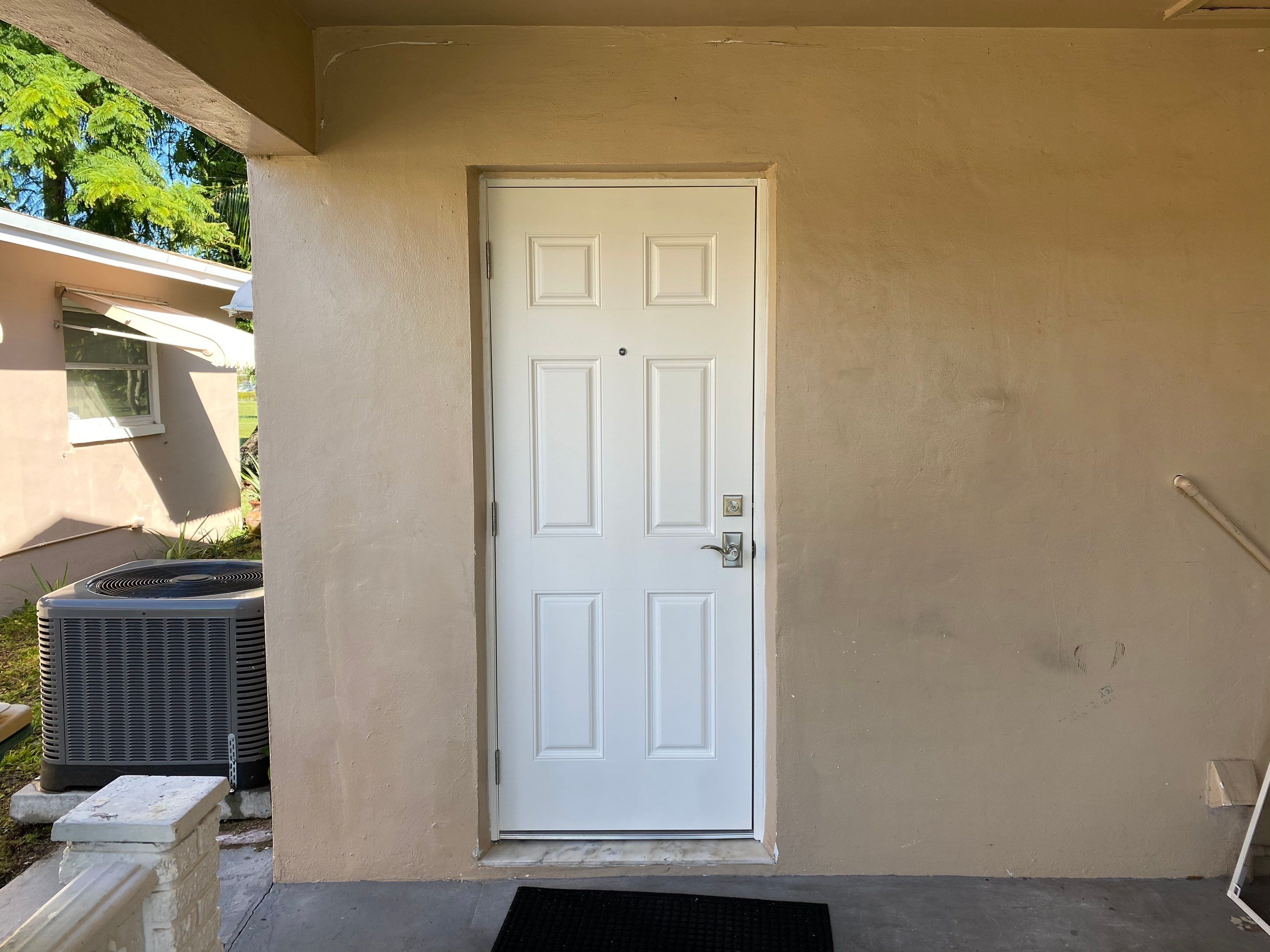 Tamarac Residential Entry Door and Aluminum Window Installation Project by The Door Doctor of South Florida, Inc.