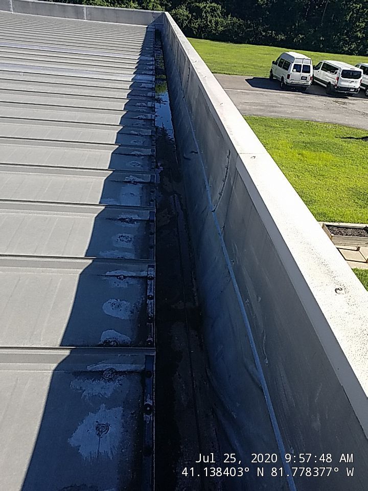 Commercial Metal Roof Coating by Gold Star Roofing LLC