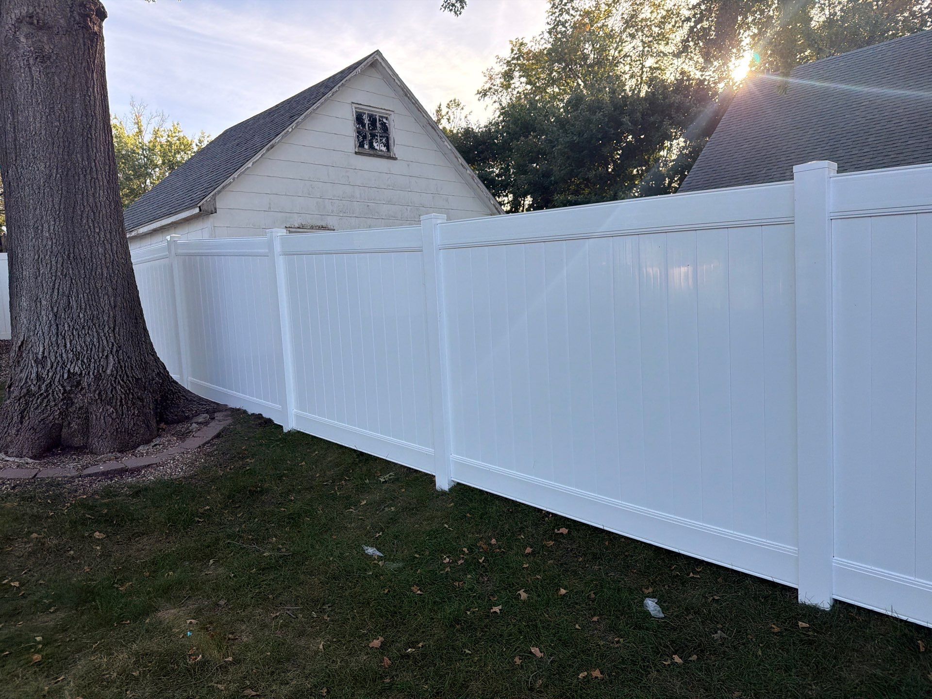 White Vinyl Privacy Fence and Gate Installation in Grundy Center by Perfect Picket Fence and Stain