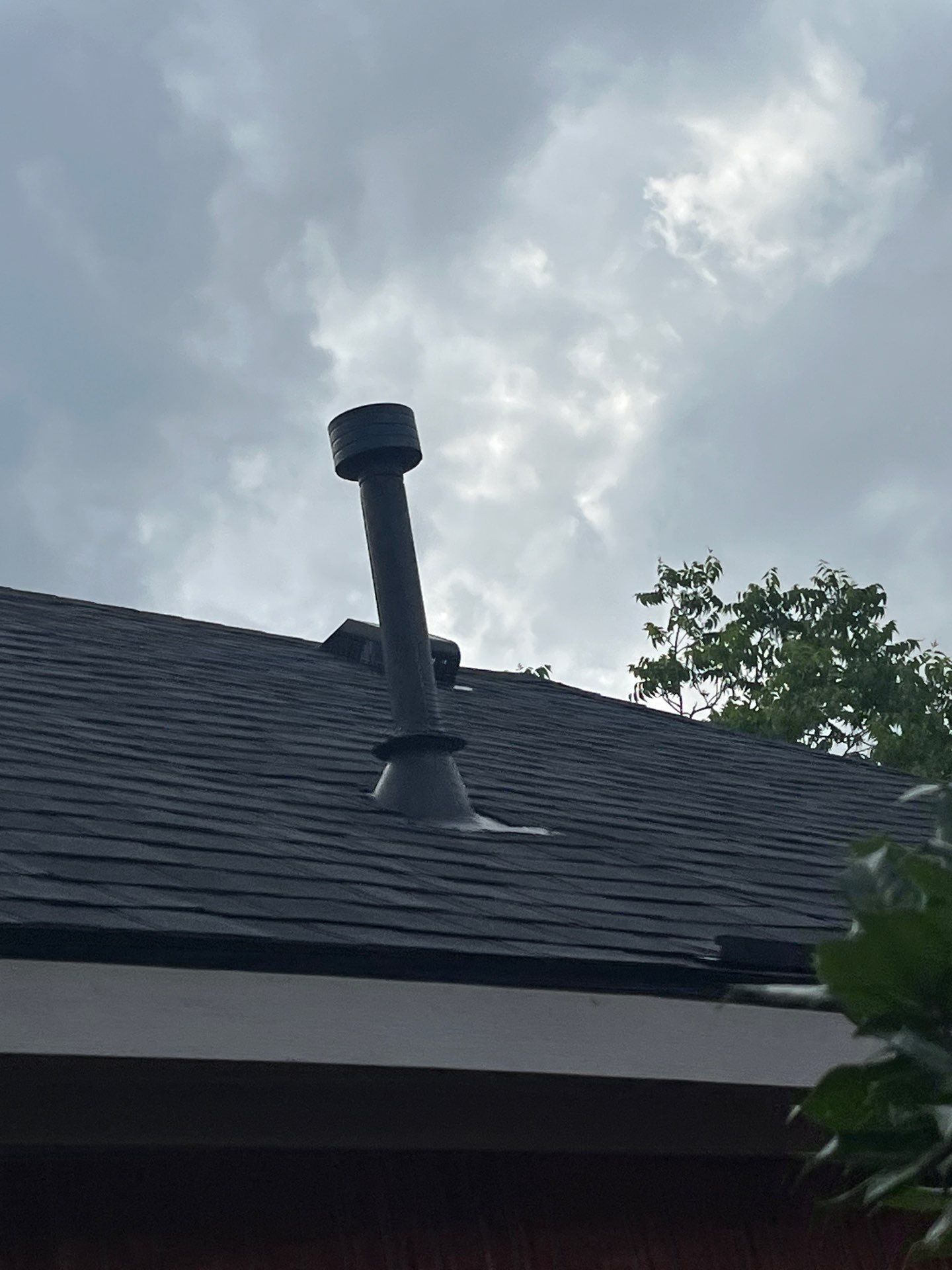 Red brick with Malarkey Midnight Black  by Tejas Roofworks + Restoration