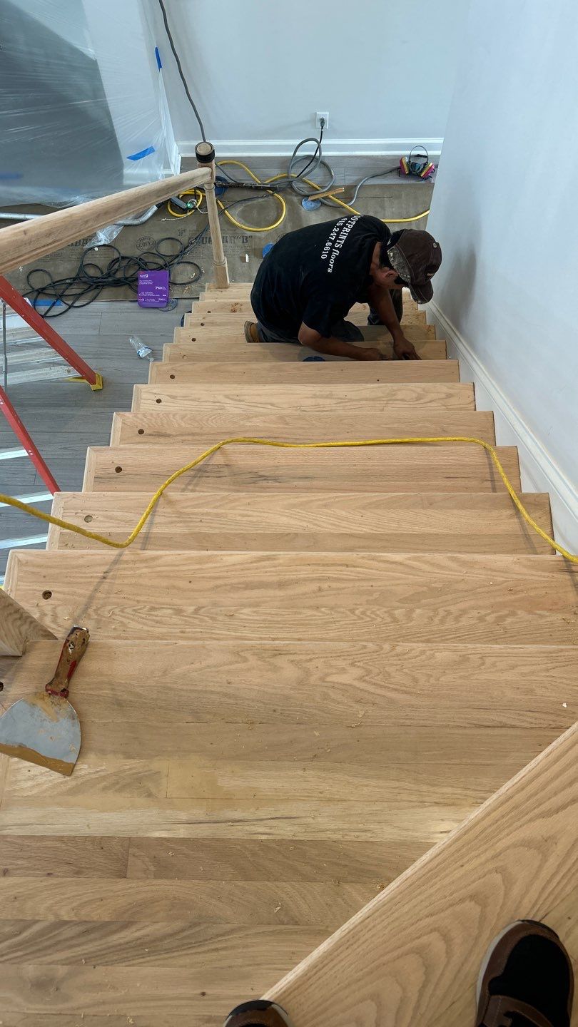Updated staircase and hallway by Footprints Floors of Nashville
