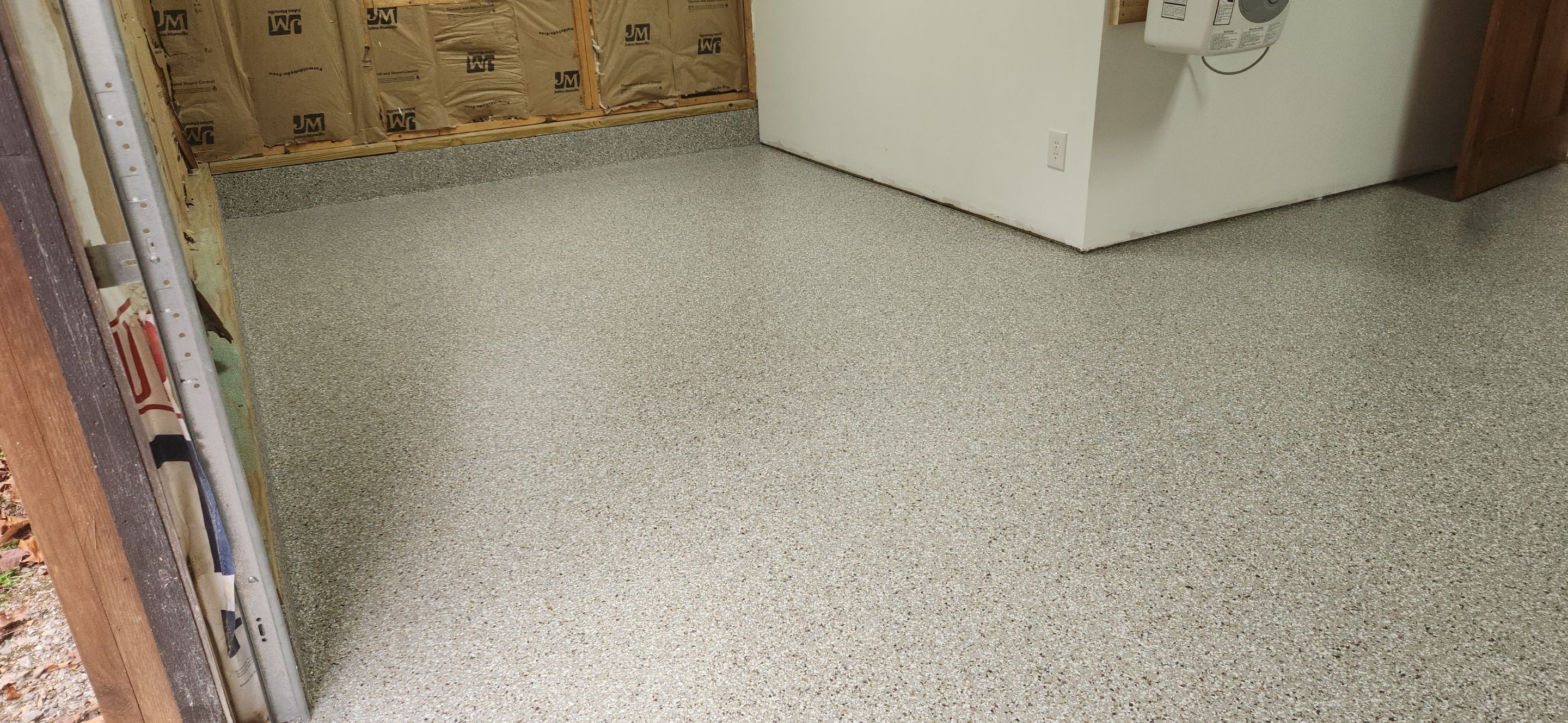 Front Porch and Garage using Creekbed by Elite Floor Solutions