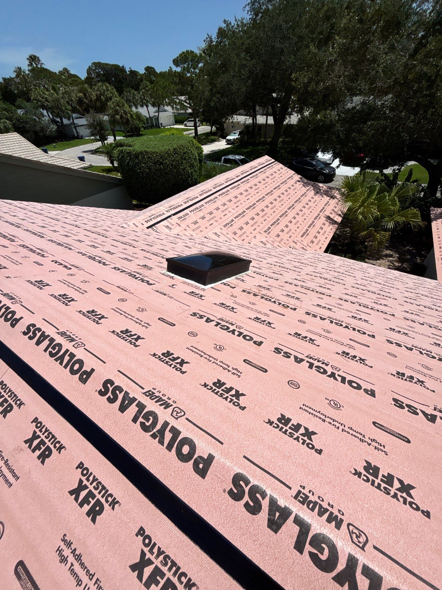 Standing Seam Metal Charcoal Grey Roof Replacement and Skylight Installation in Jupiter by Art's Roofing & Construction