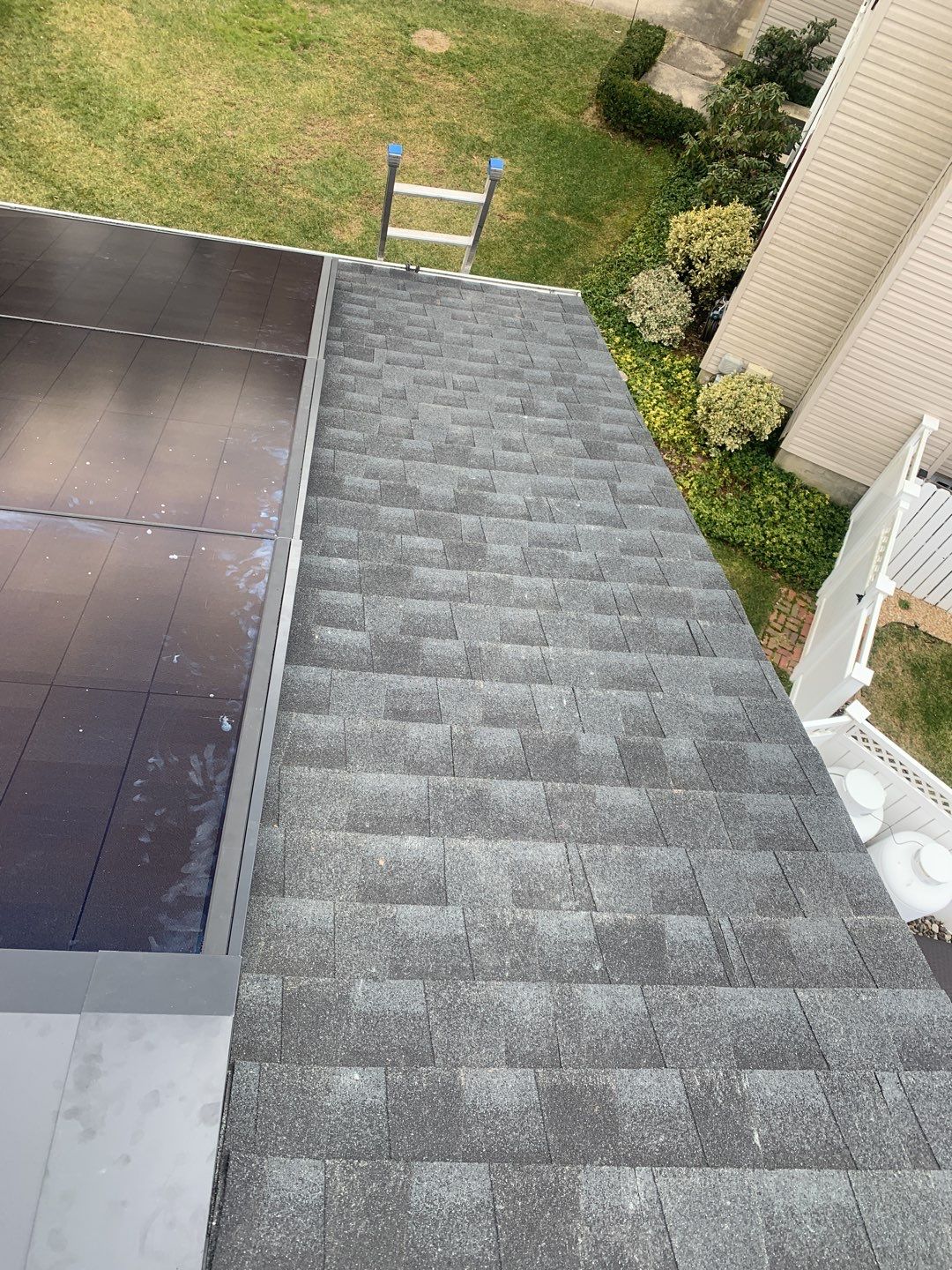 Roof Replacement with GAF Decotech integrated solar panels by American Home Contractors