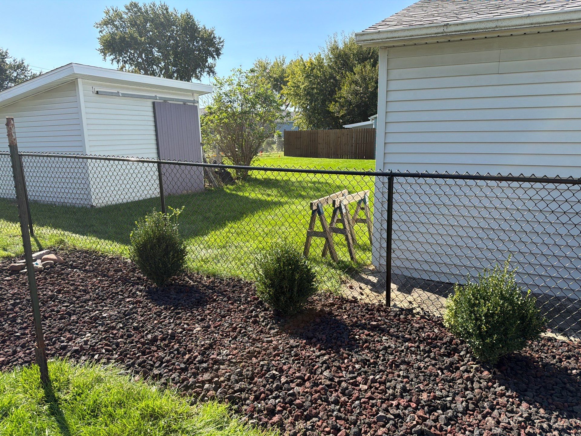 Custom Vinyl Privacy and Black Chain Link Fence Installation in Cedar Falls by Perfect Picket Fence and Stain