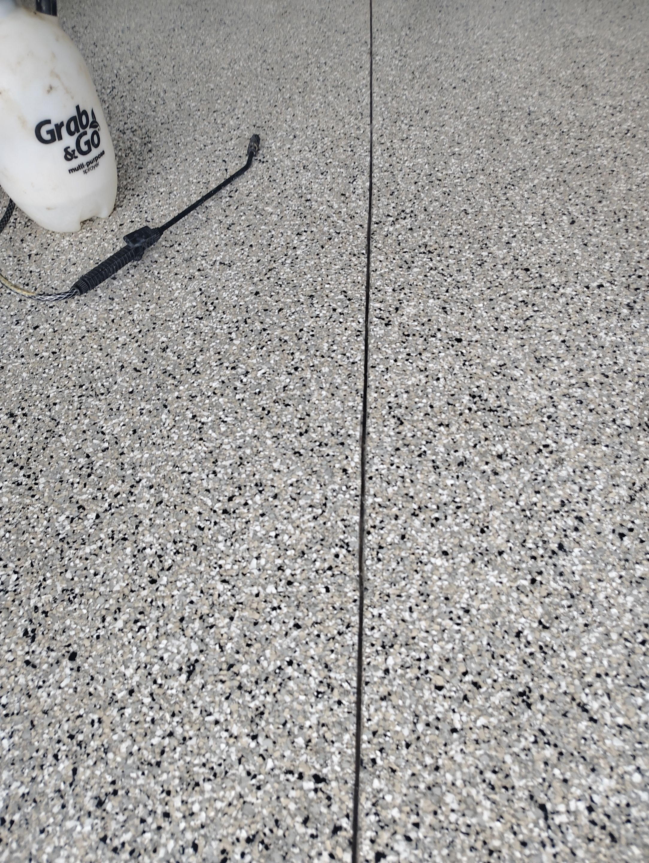Gray and White Speckled Epoxy Garage Floor Coating in Tea by Select Painting, Coatings & Garage Cabinets
