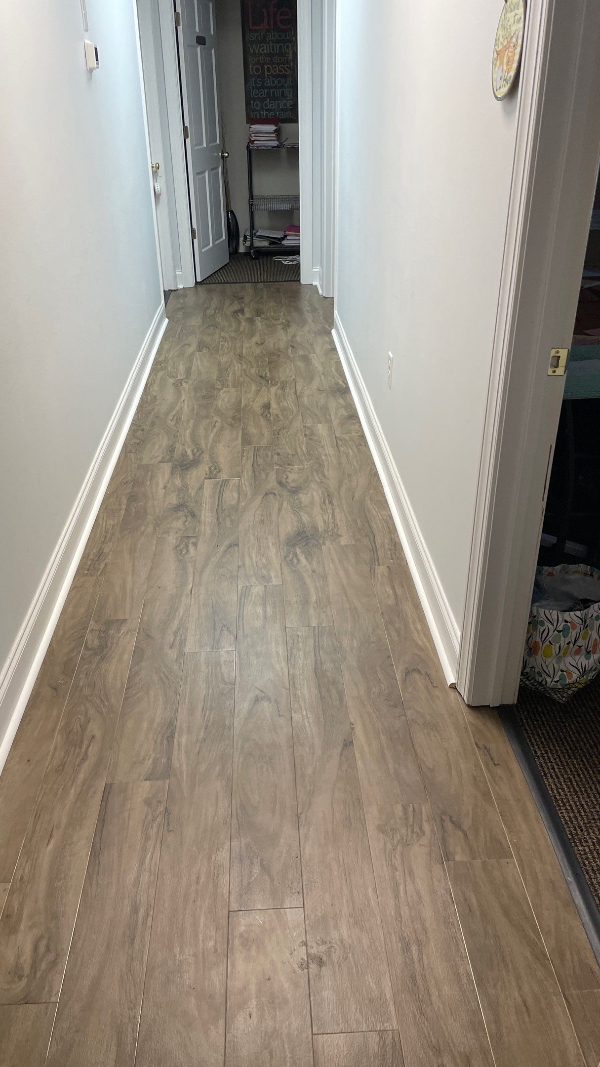 Office Remodel from Worn Out Carpet to Sleek Glued Down LVP by Footprints Floors of Coastal Carolina