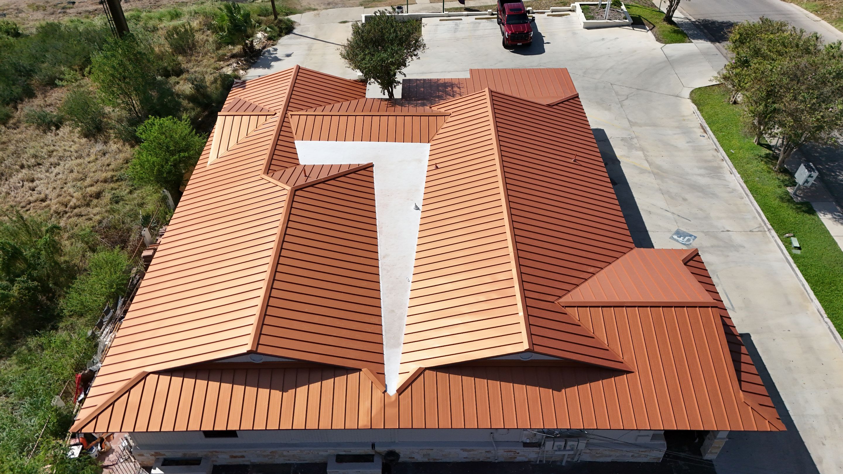 Copper Standing Seam Metal Roof Installation for Laredo Medical Clinic by JM Flores Roofing & Construction, Inc