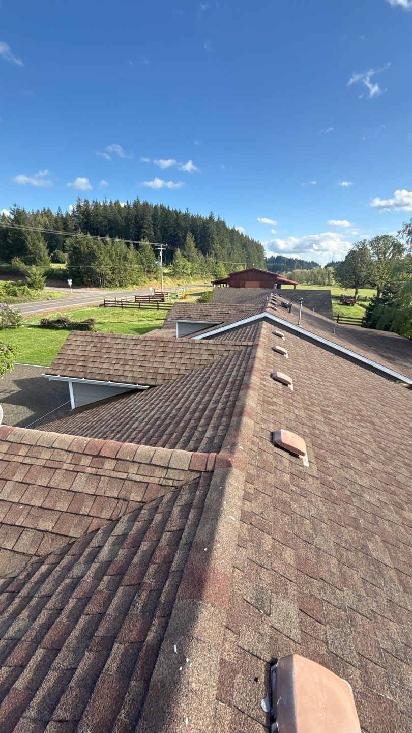 Residential Roof Replacement with Metal Accents by Orezona Building & Roofing Company, Inc.
