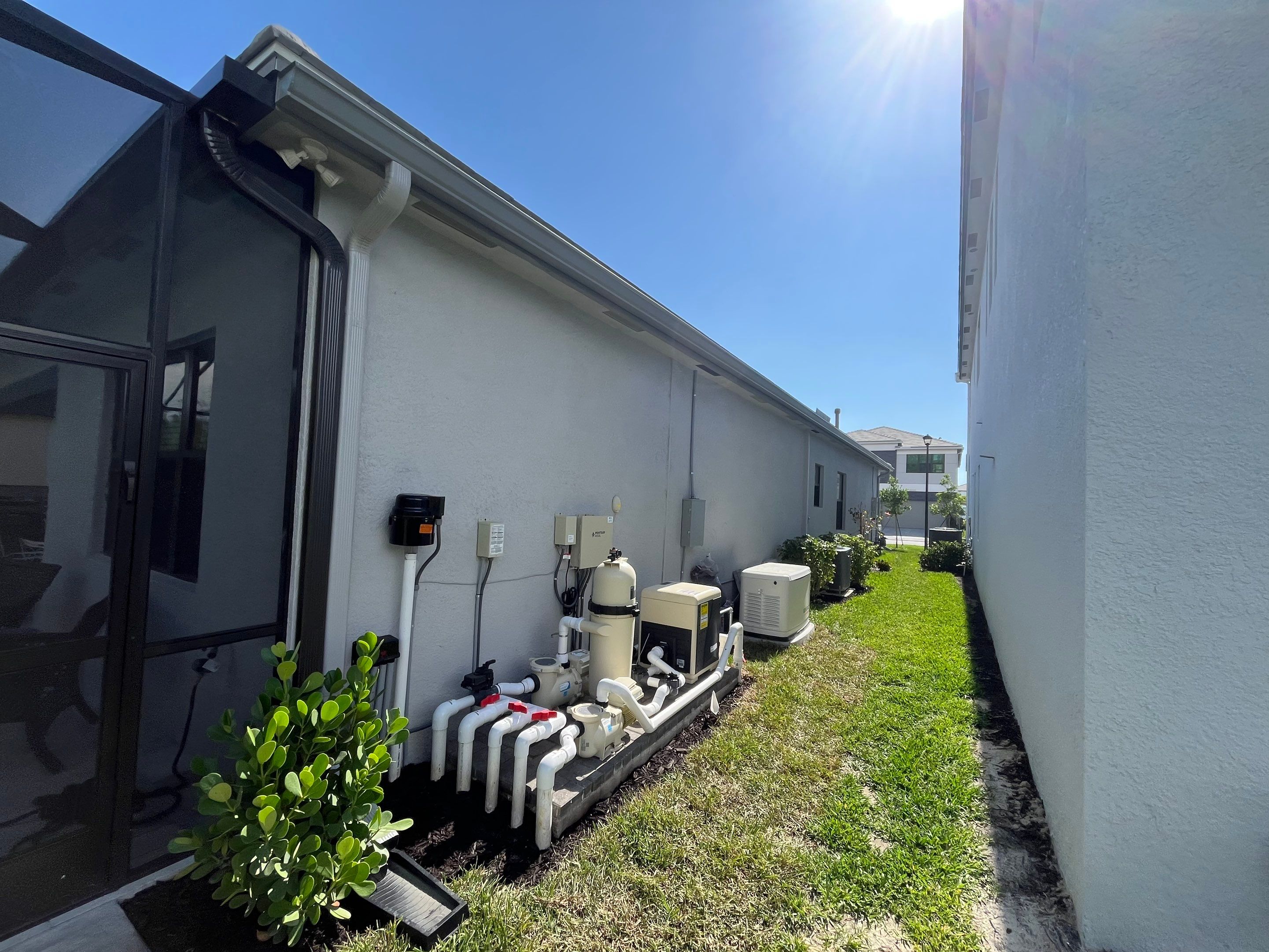 Grey Seamless Gutter Installation in Estero FL by Gutter Professors