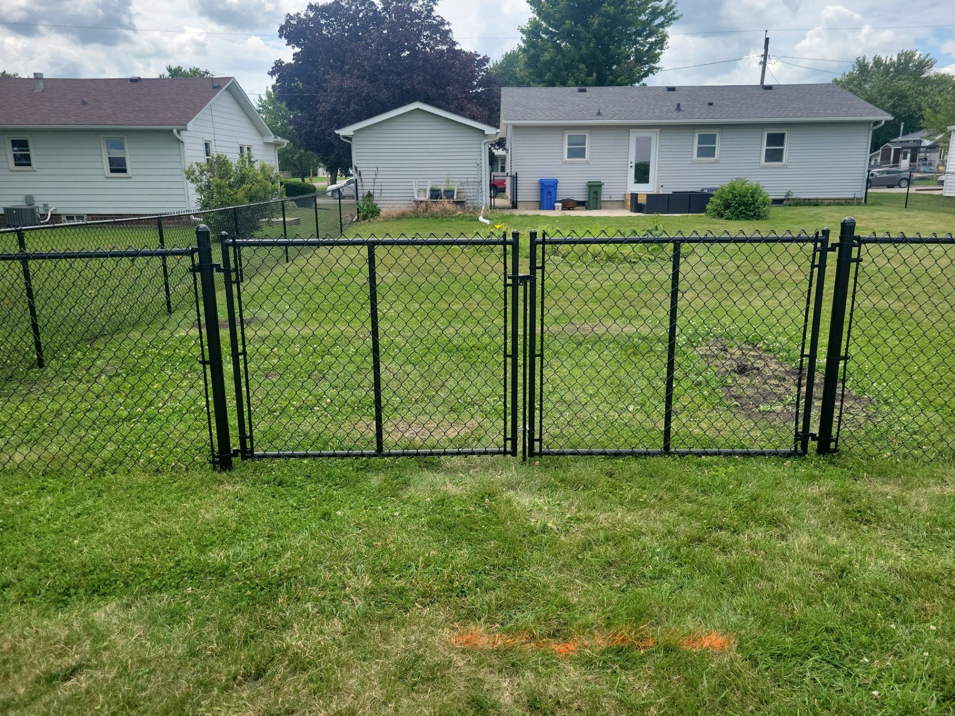 Residential Black Vinyl-Coated Chain Link Fence Installation in Allison by Perfect Picket Fence and Stain