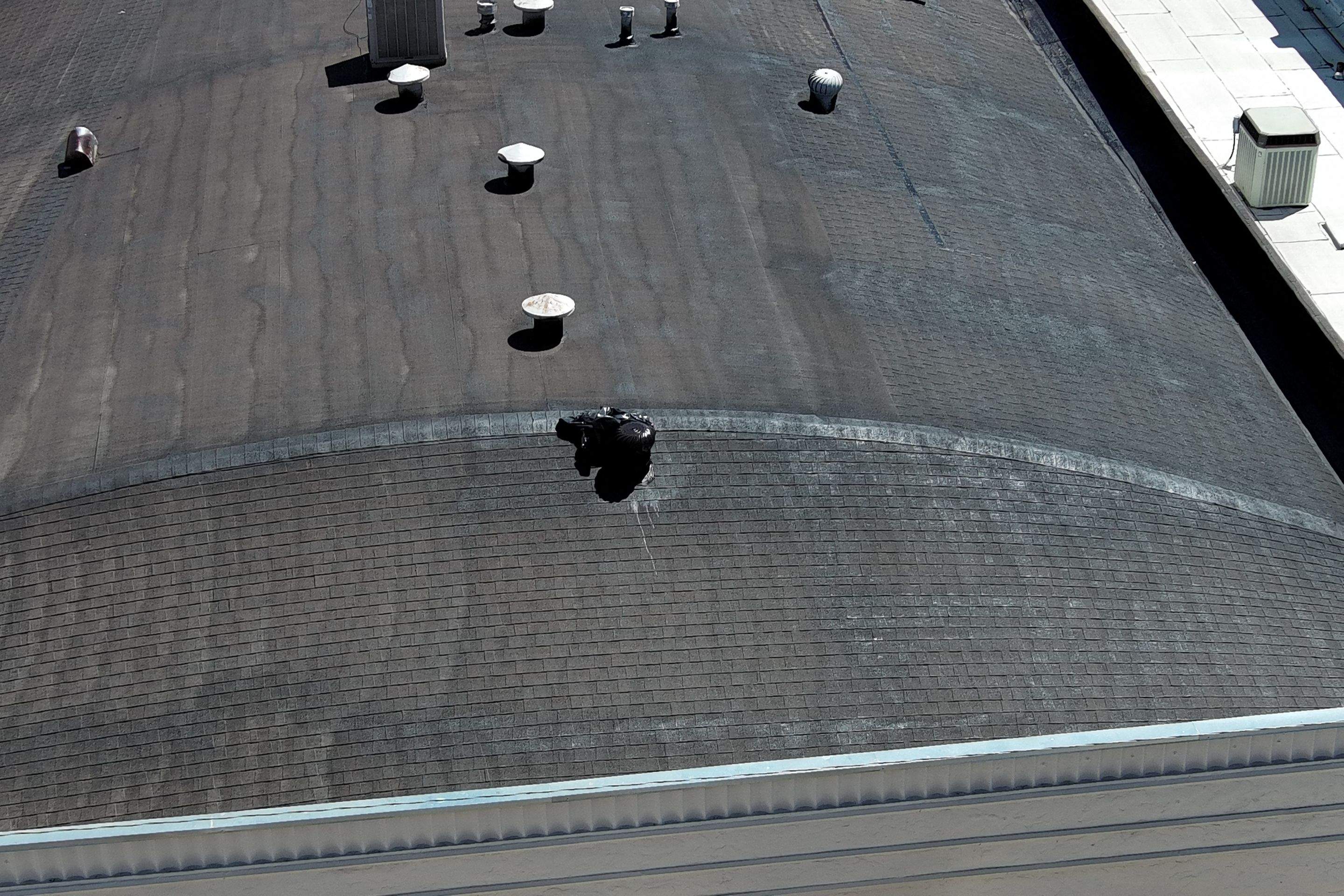 Foam and coatings on commercial roof by Straight Edge Roofing Inc