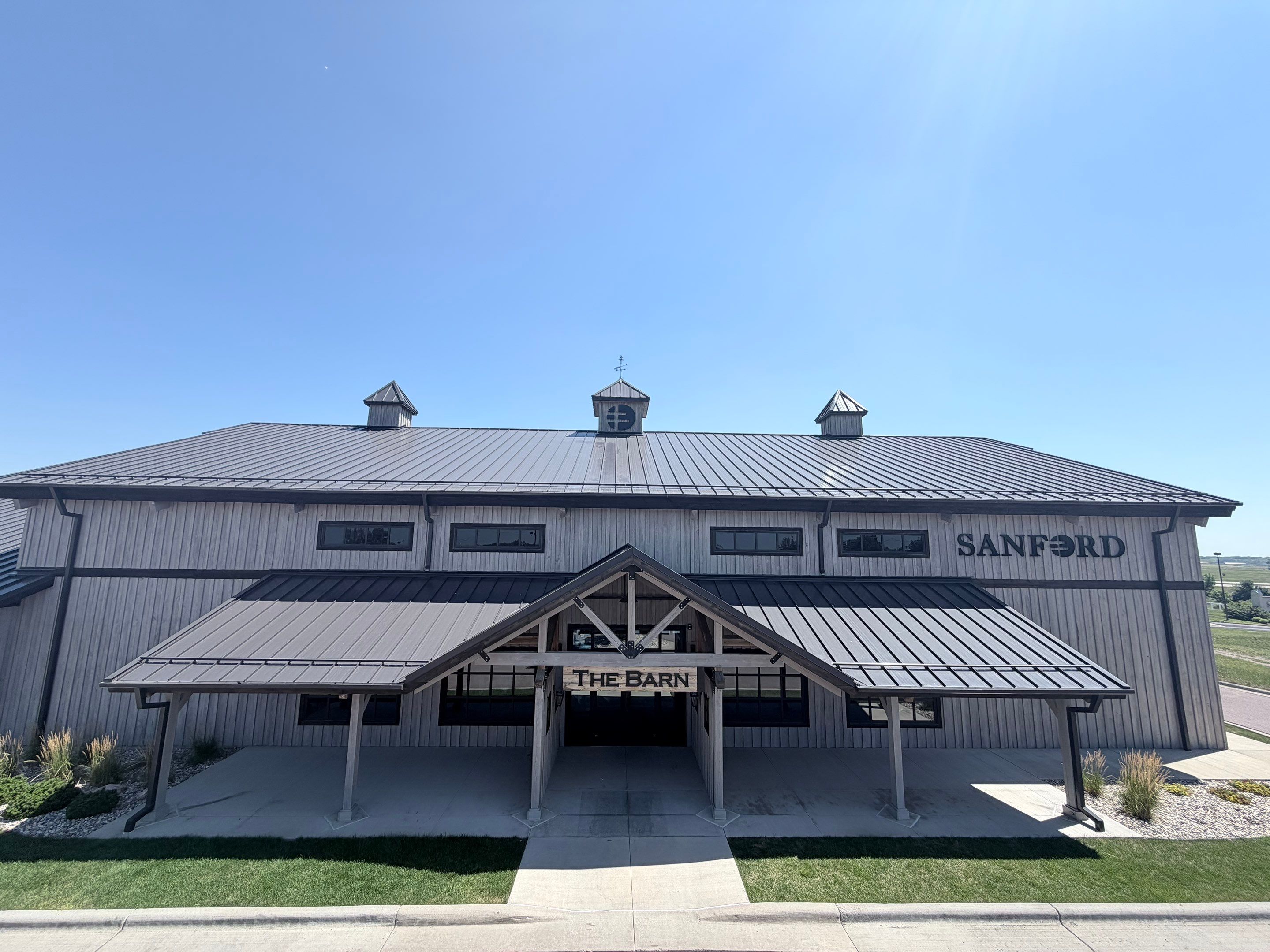 Commercial Exterior Wood Staining for Sanford Barn in Sioux Falls by Select Painting, Coatings & Garage Cabinets