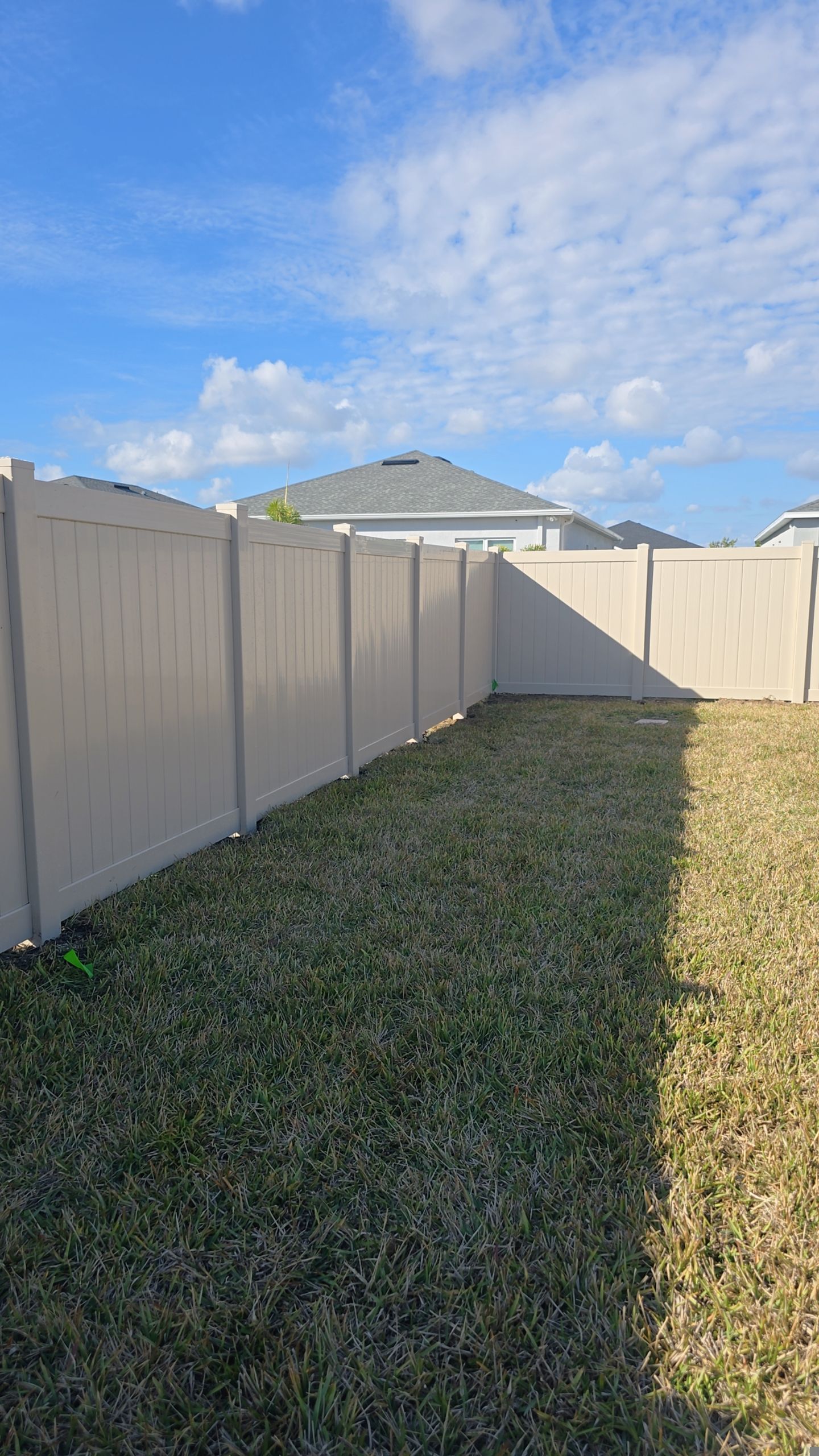 Tan Vinyl Fence in West Port by True Fence LLC
