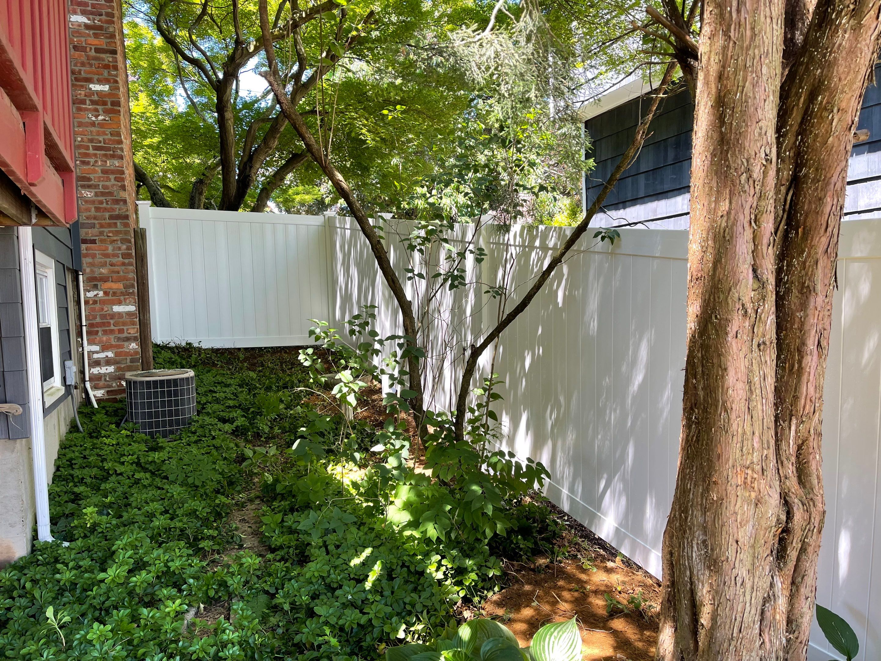 Replacement Vinyl Privacy Fence in White by DiGiorgi Roofing and Siding Inc
