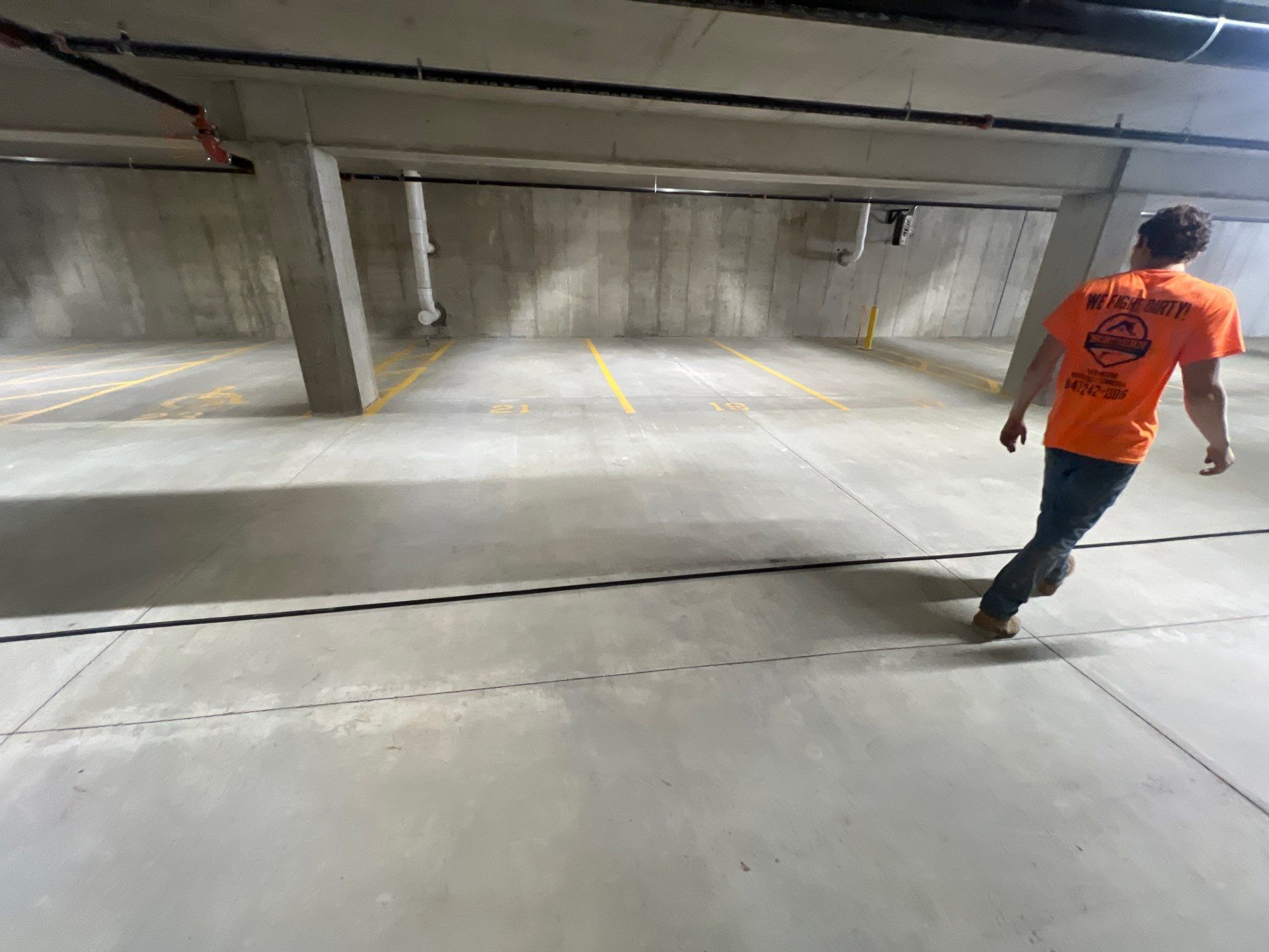 Parking garage using Hot water by Northern Power Washing LLC.