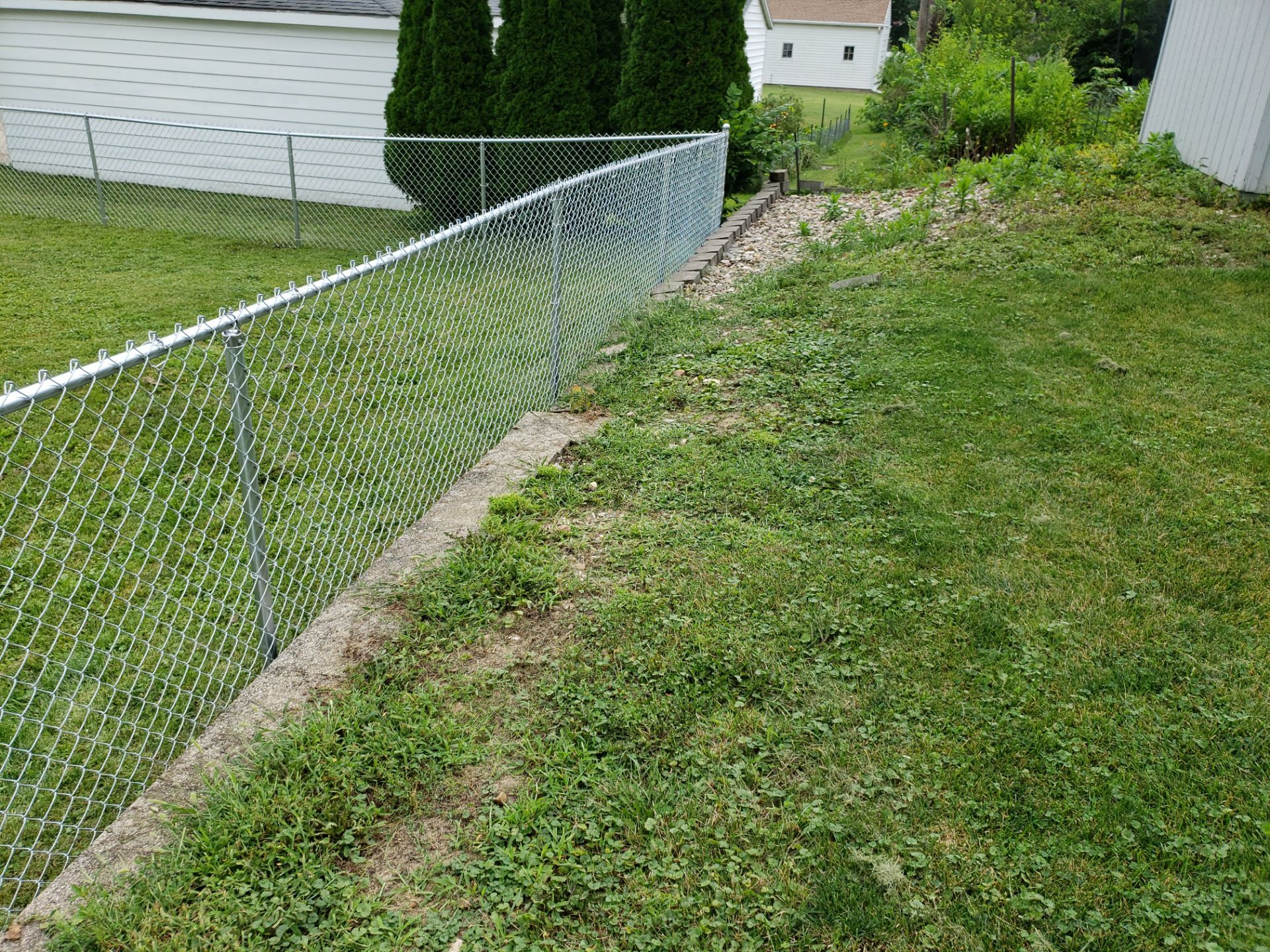 Residential Chain Link Fence and Gate Installation in Waterloo by Perfect Picket Fence and Stain