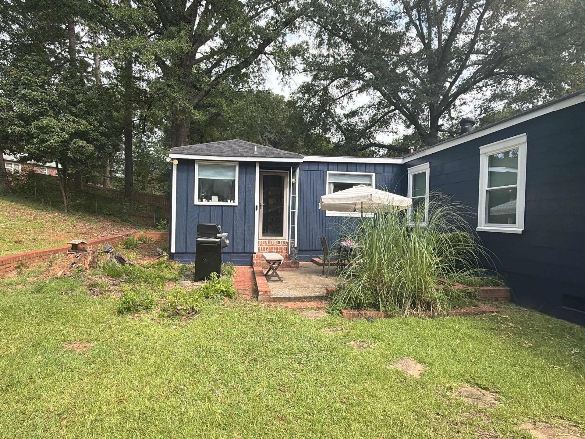 Full Exterior Repaint with Navy Blue and White Trim by Swift Home Renovations