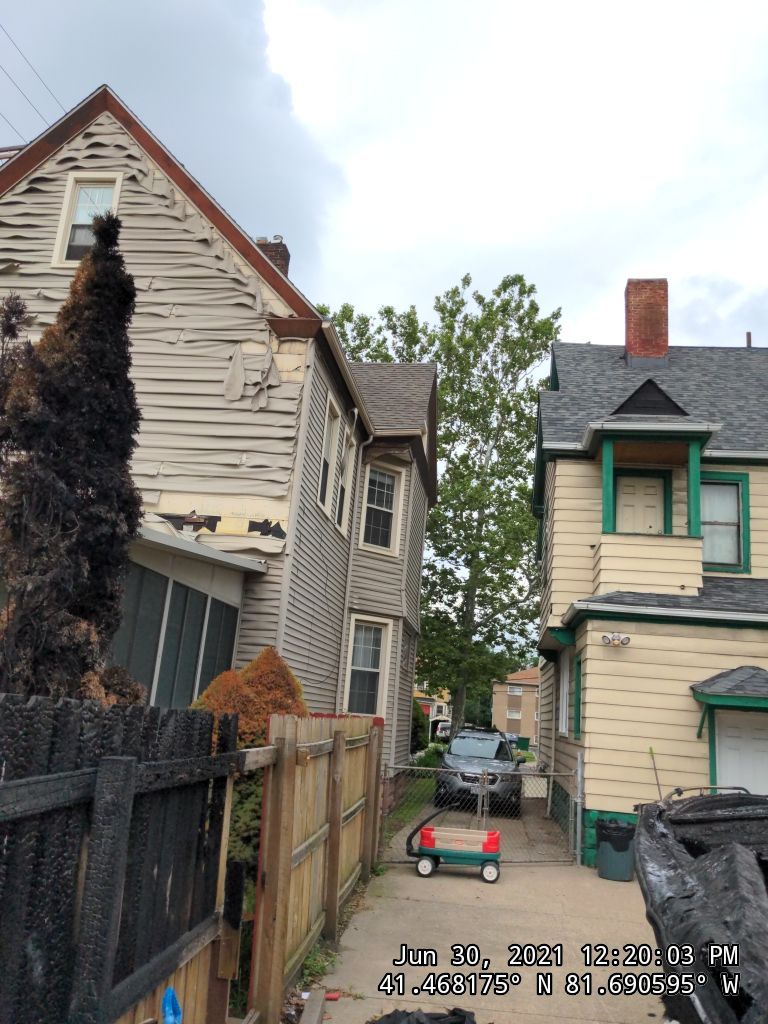 Fire damaged home in Tremont by Absolute Roofing and Construction