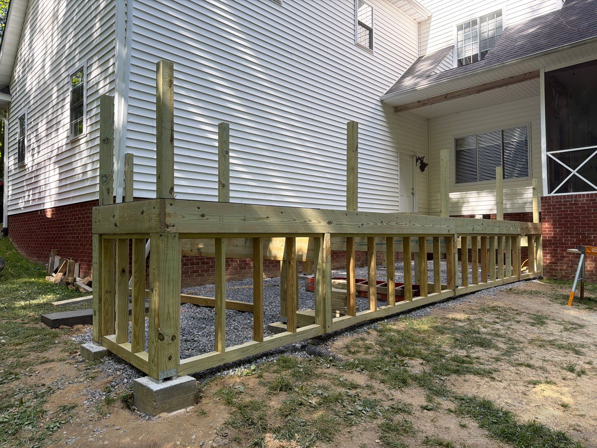 Custom Composite Deck and White Vinyl Railing Installation in Fayetteville by Walnut Hollow Decks & Outdoor Living