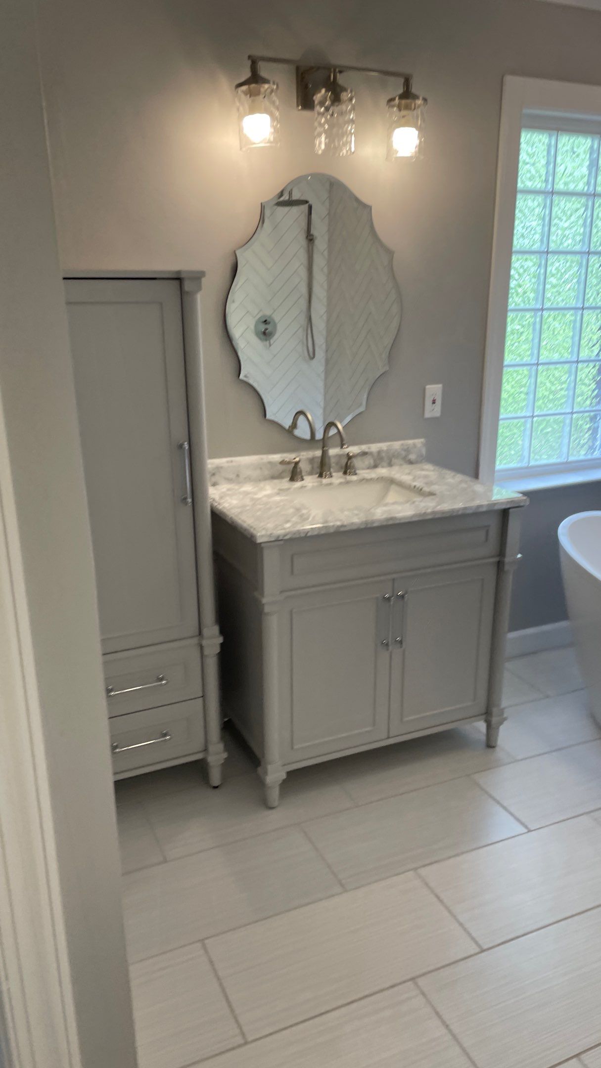 Bathroom Remodel using Schluter by Footprints Floors of Coastal Carolina