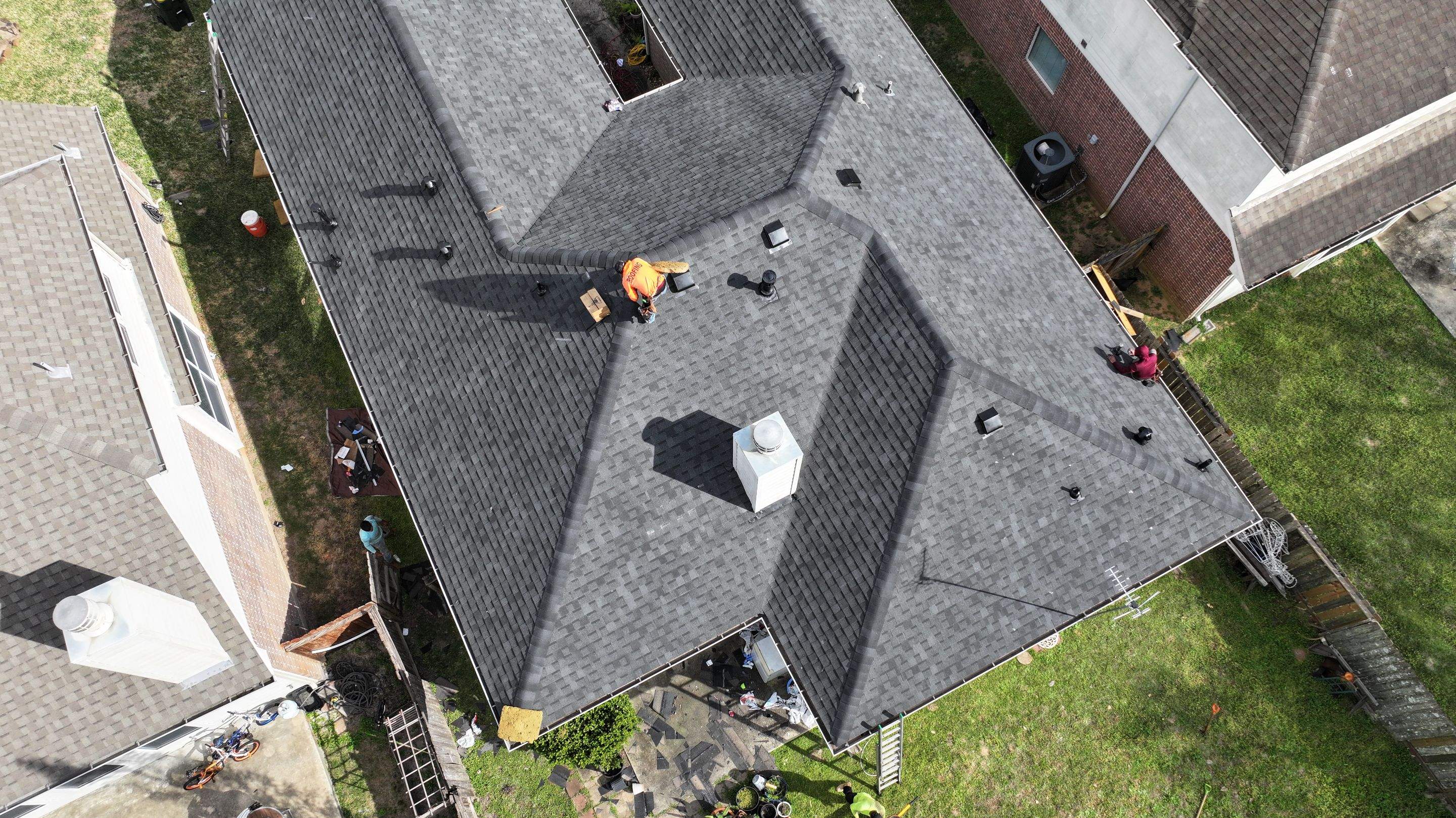 Full Roof Replacement on Brick Two-Story — Conroe, TX by PL Roofing & SB Roofing, LLC.