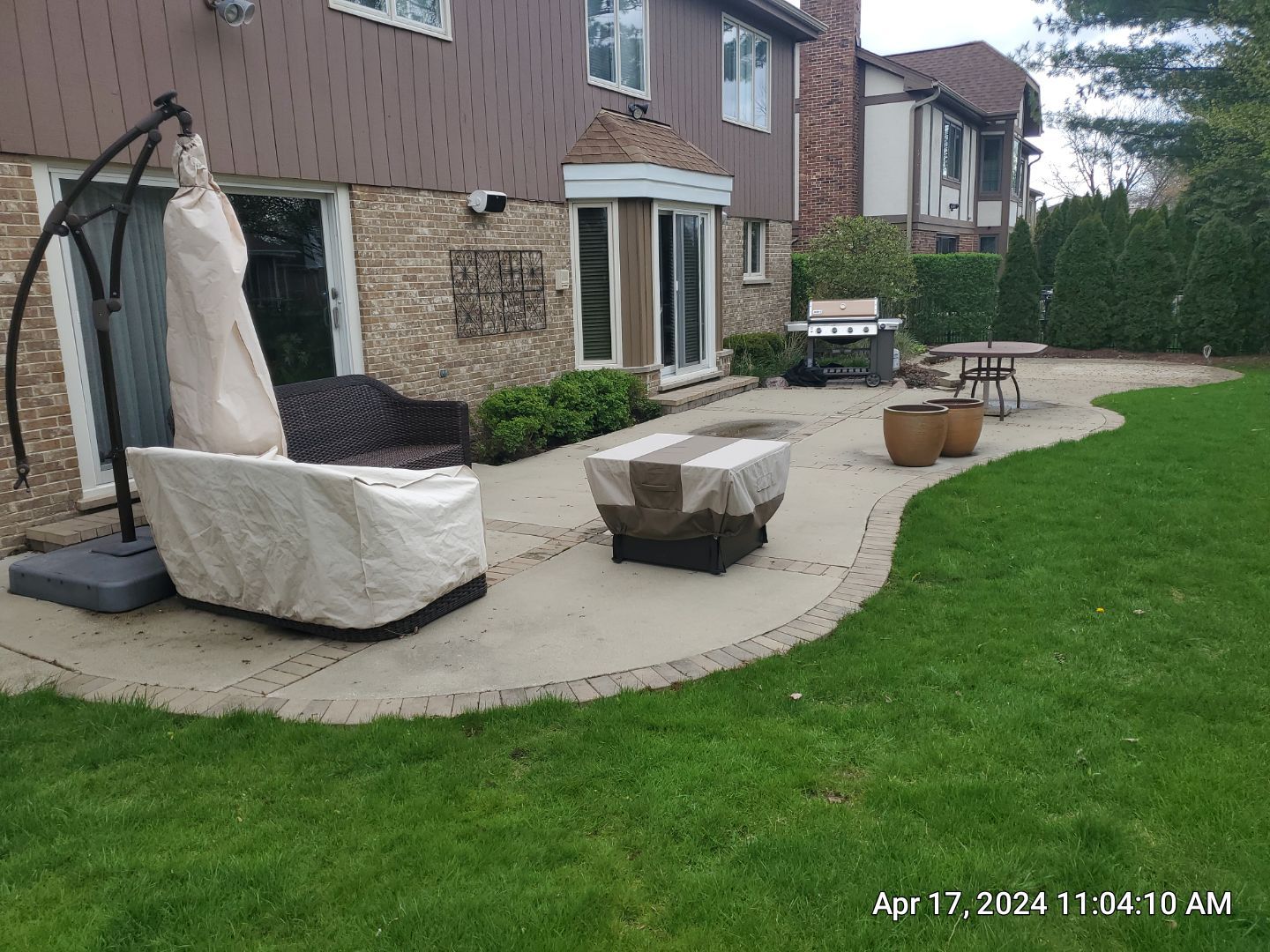 concrete patio and driveway cleaning by Northern Power Washing LLC.