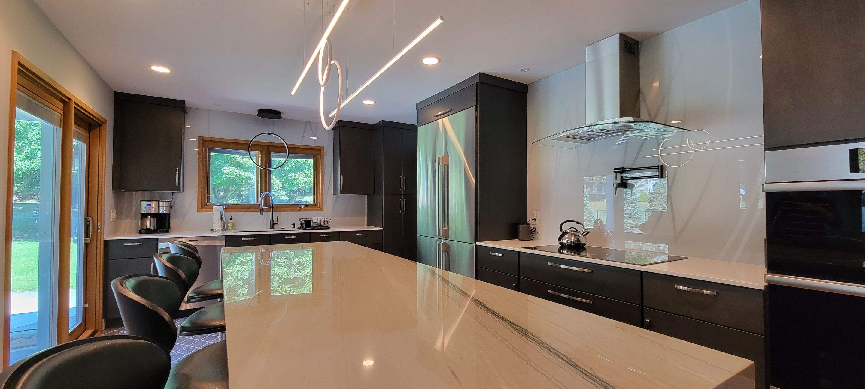 Kitchen Remodel using IMAGIO Misty Curves Solid Glass Backsplash by IMAGIO