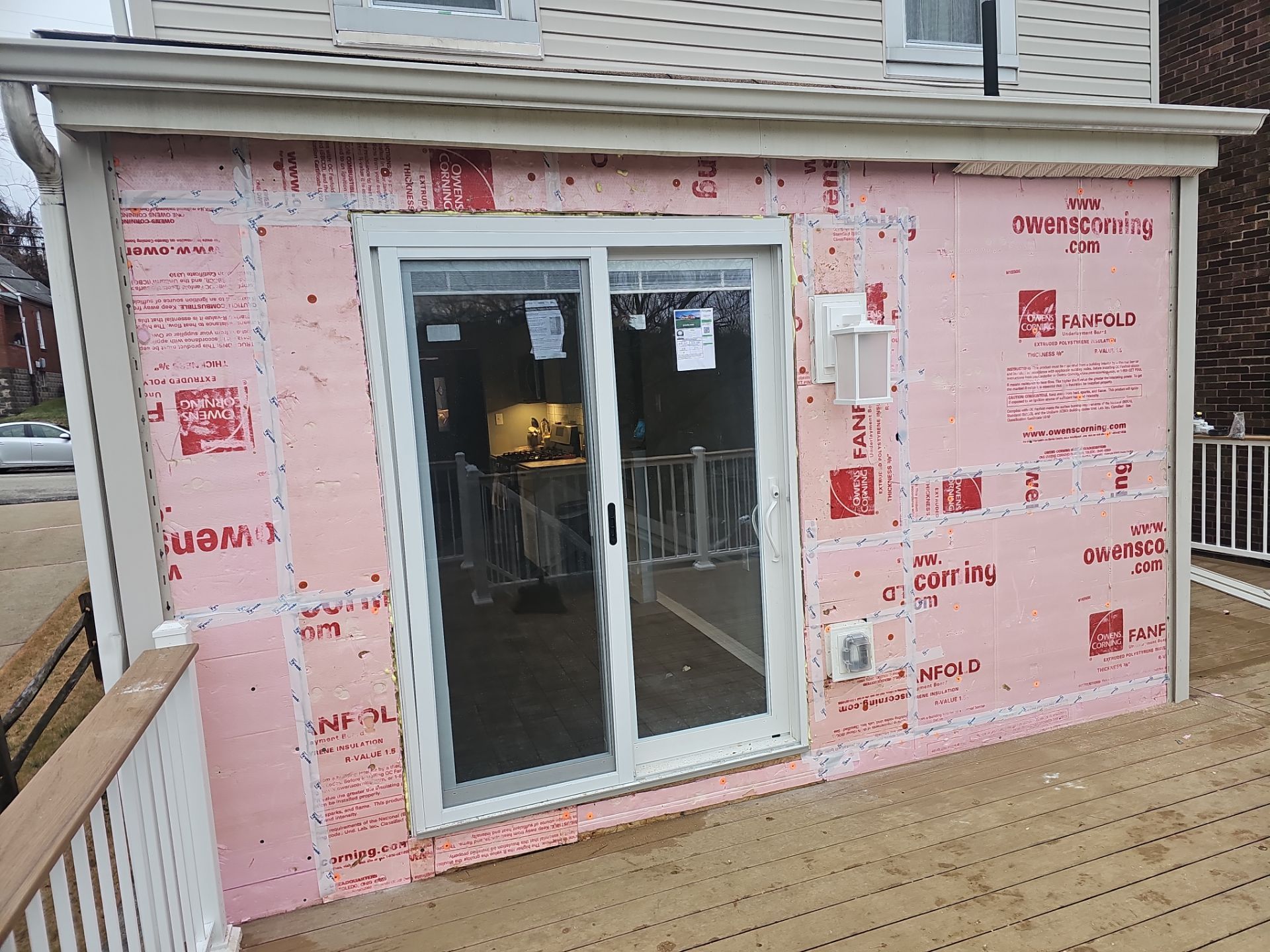 Deck and door by Cousins Roofing Siding & Decks