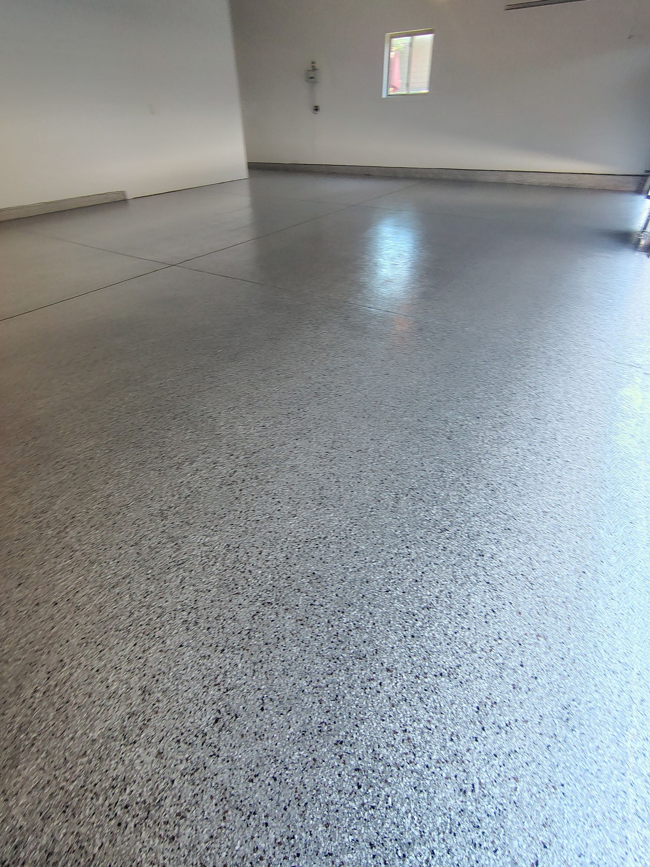 Custom Grey Speckled Epoxy Floor Coating for Sioux Falls Garage by Select Painting, Coatings & Garage Cabinets
