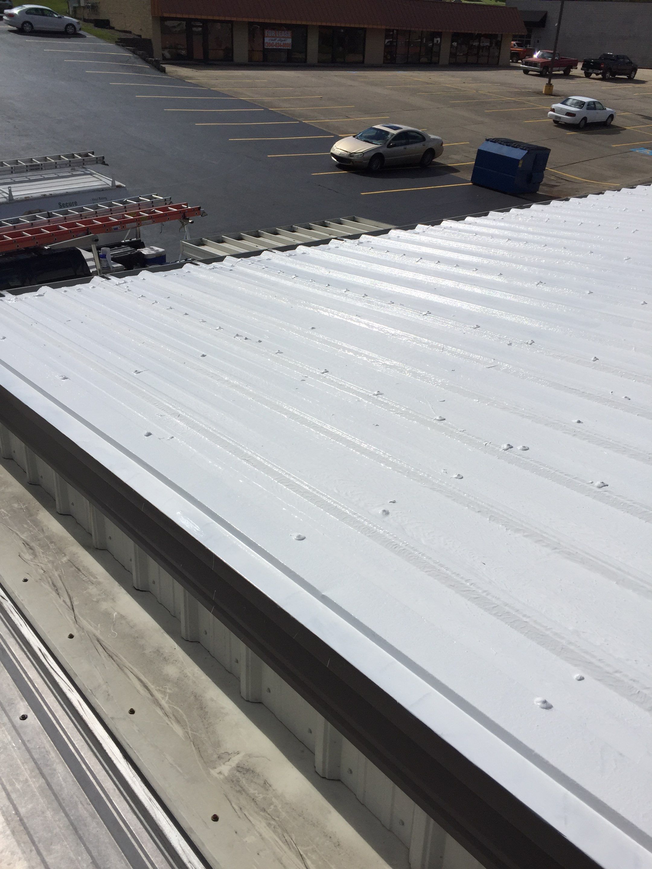 Commercial Roof Coating using Gaco Silicone Roof Coating by Secure Construction Company Inc