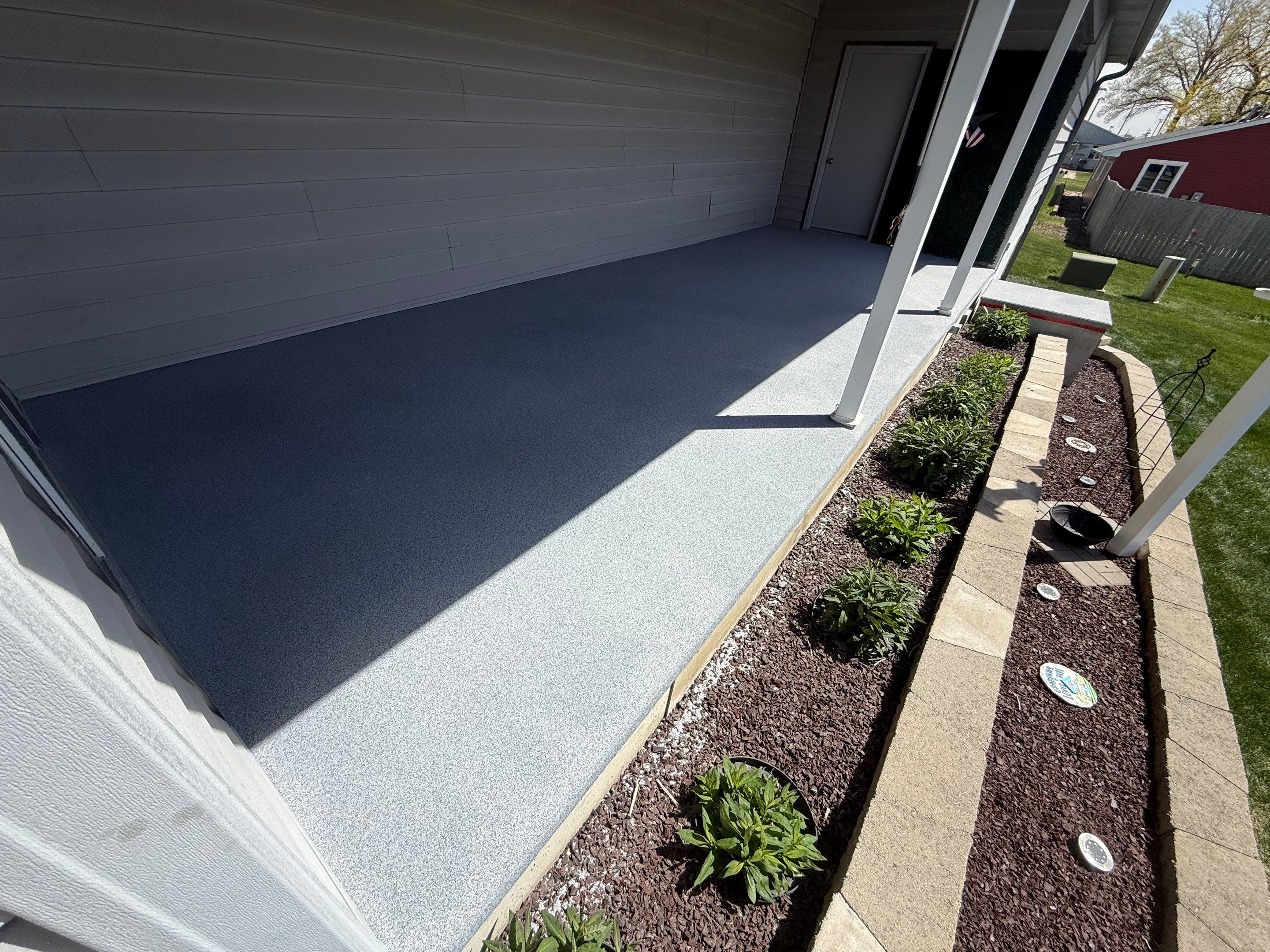 Custom Grey Flake Epoxy Garage Floor Installation in Remsen by Select Painting, Coatings & Garage Cabinets