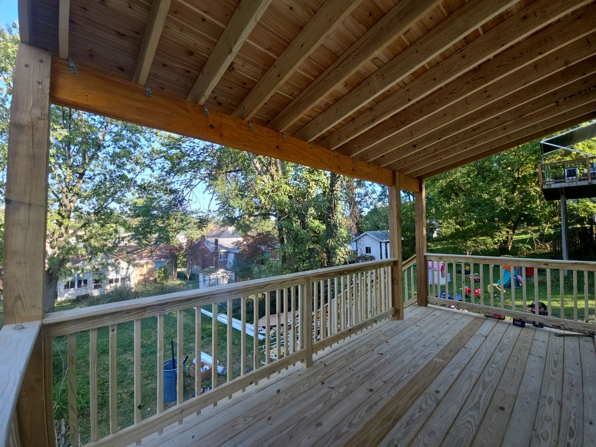 Deck and shed roof by Cousins Roofing Siding & Decks