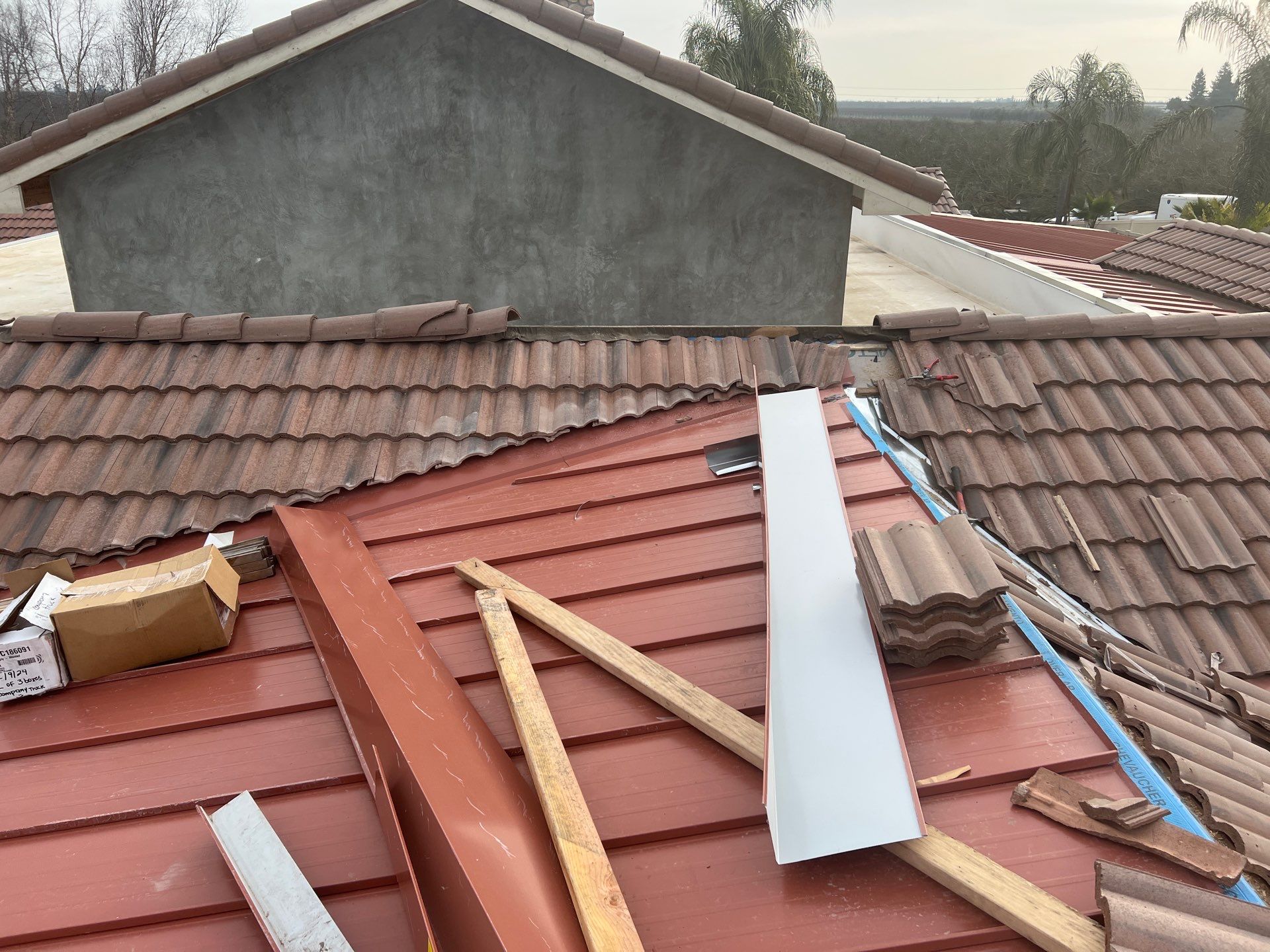 Tile, Metal, and TPO roofing project (new construction) by Straight Edge Roofing Inc