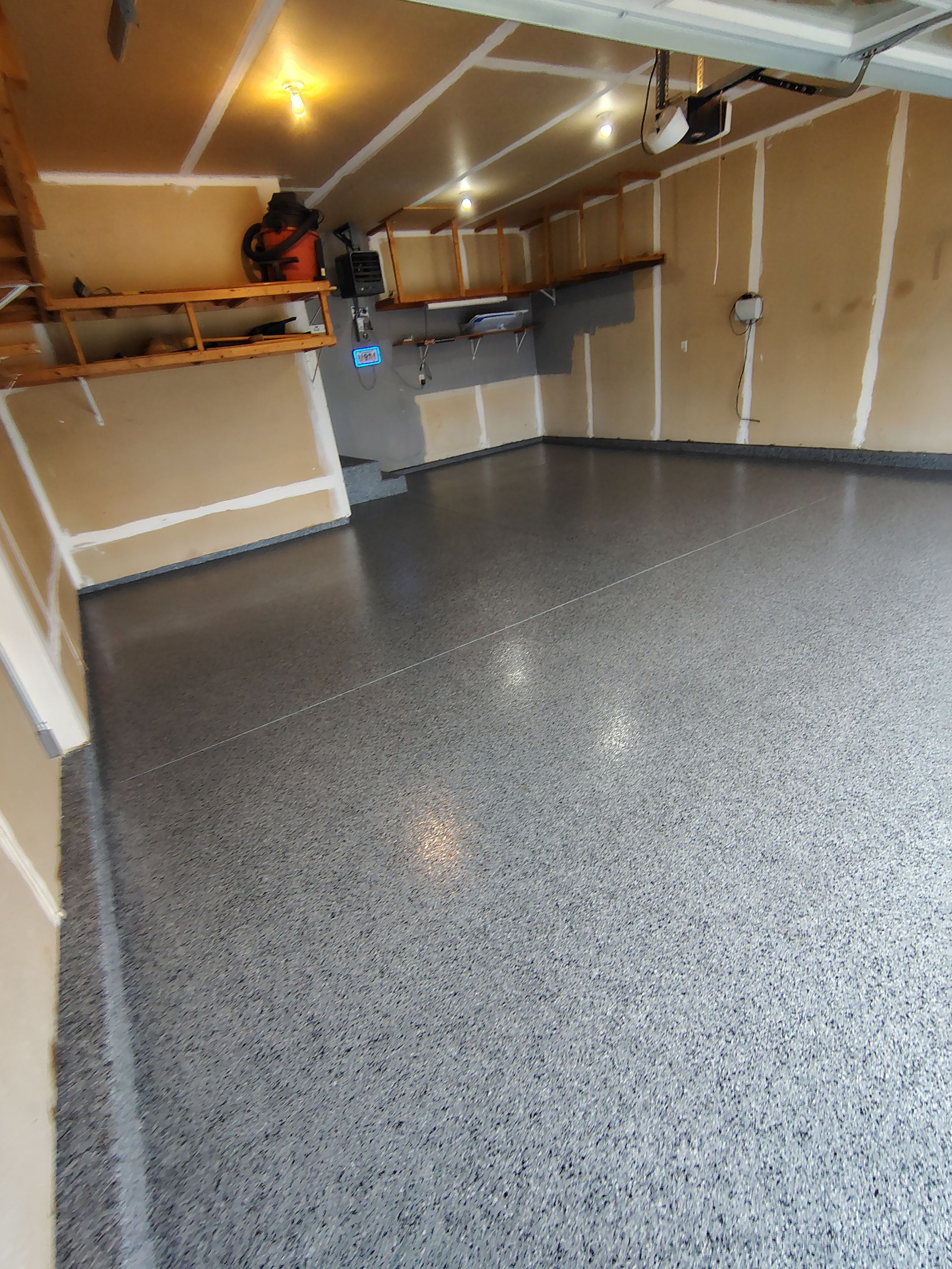 Nightfall Grey Speckled Epoxy Garage Floor Coating in Sioux Falls by Select Painting, Coatings & Garage Cabinets