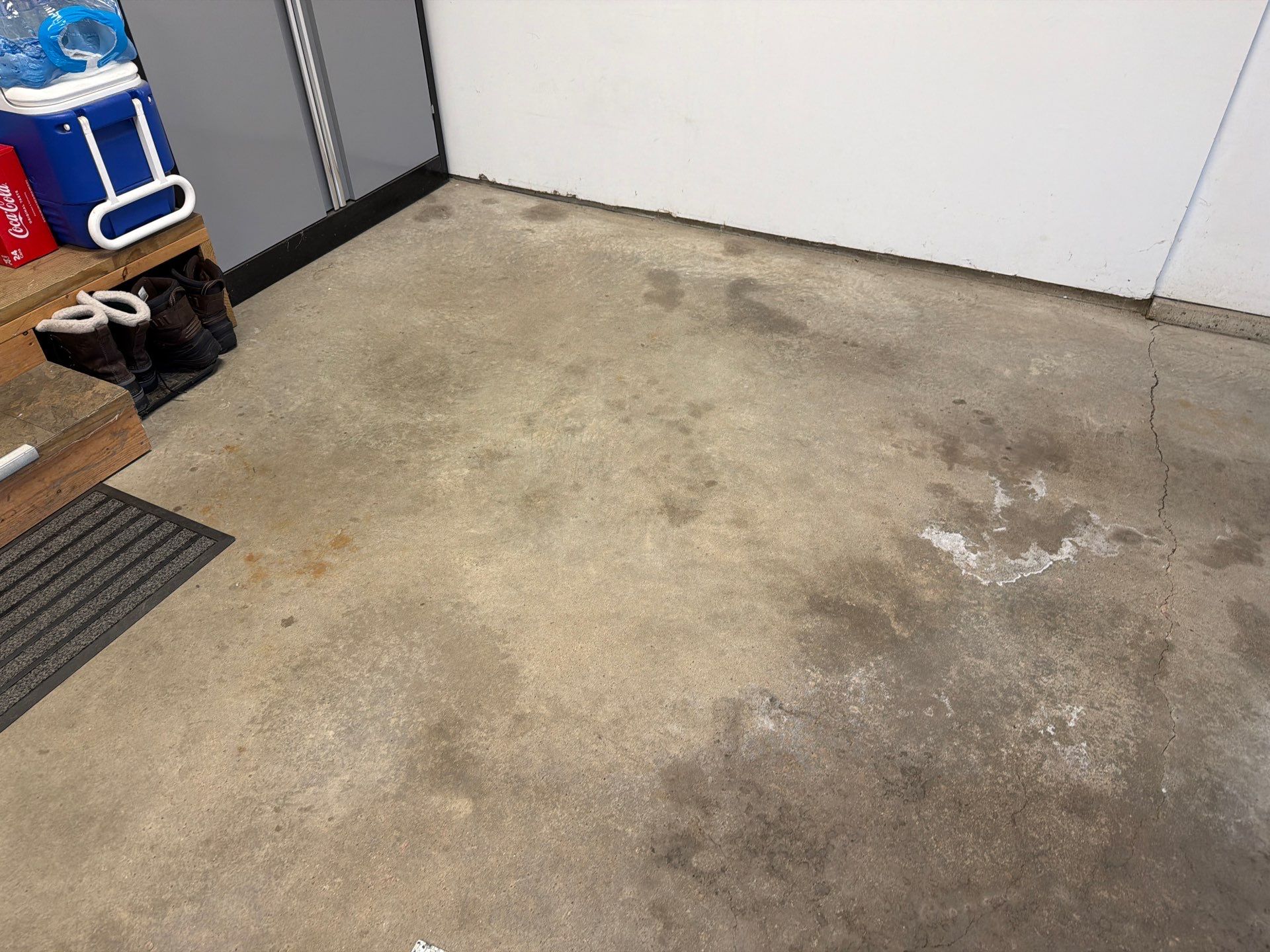 Feather Grey Garage Floor Coating Installation in Sioux Falls by Select Painting, Coatings & Garage Cabinets
